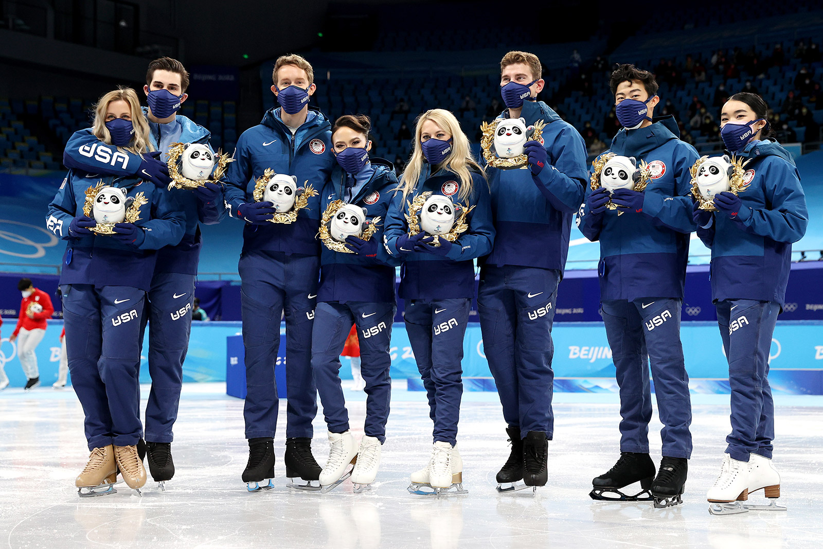The United States figure skating team poses after winning silver in the team event on Feb. 7.