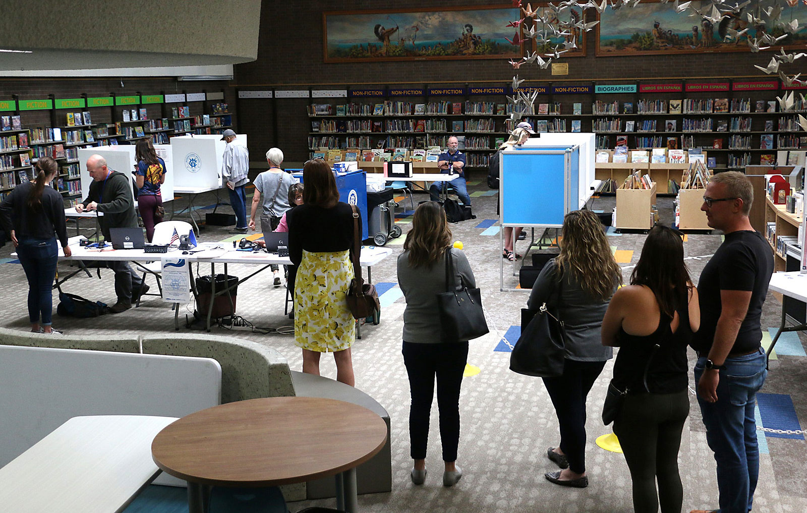 People vote during the primary election at the Downtown Reno Library on June 14.