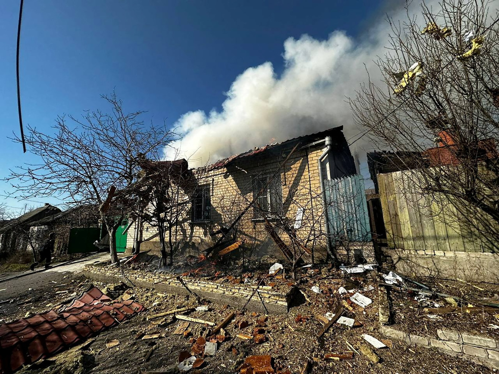 A burning residential house is seen after a Russian military strike in Kherson, Ukraine, on March 9.