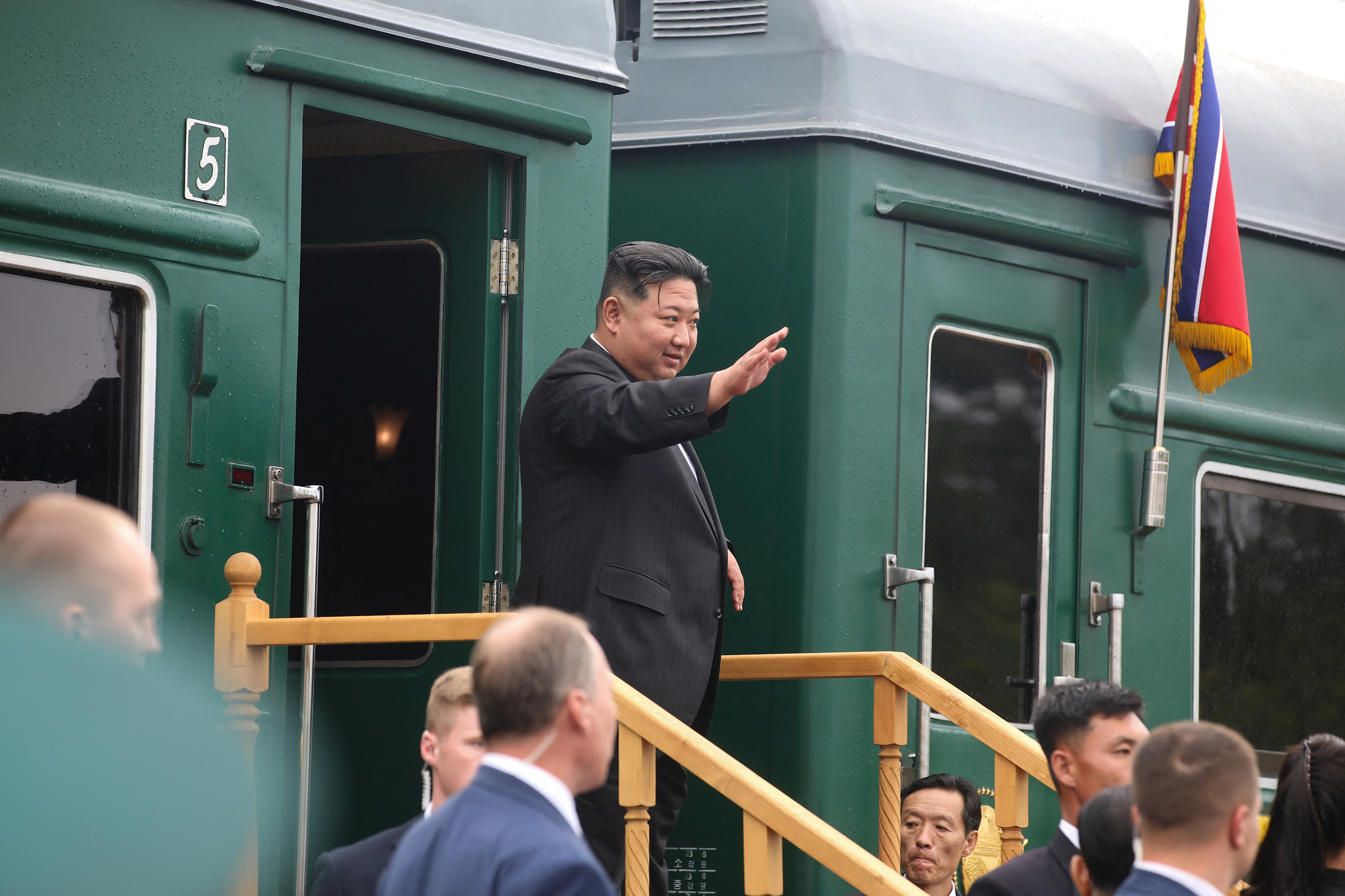 North Korean leader Kim Jong Un waves as he boards his train in Artyom, Russia, on September 17. 
