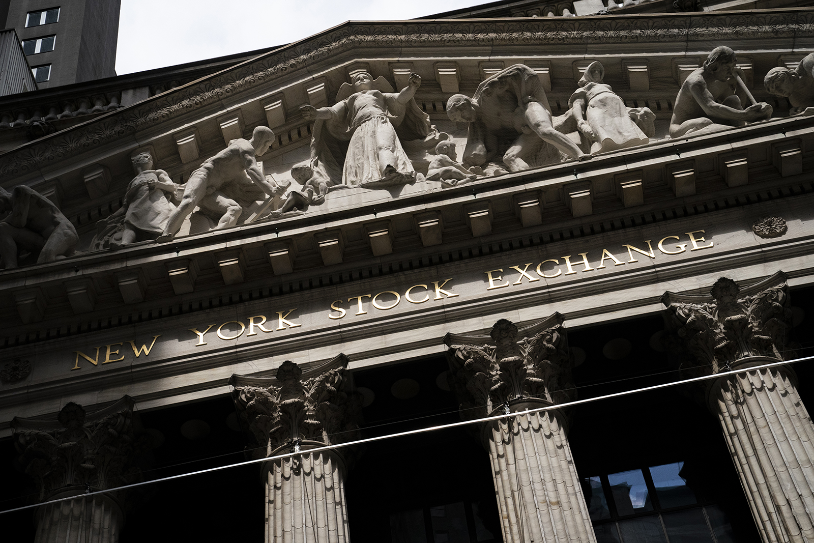 Statues adorn the facade of the New York Stock Exchange on Thursday, July 14.