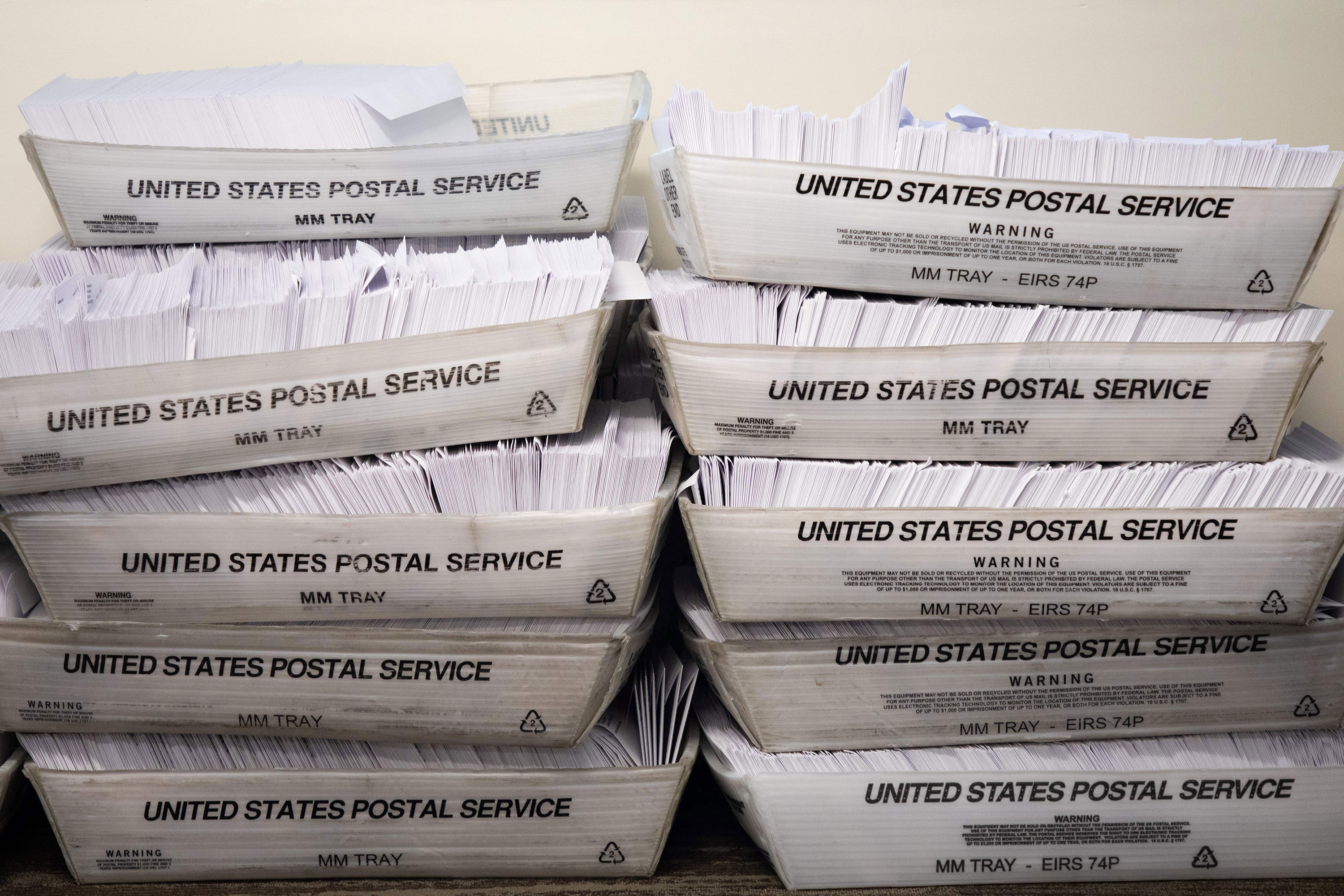 Large boxes of envelopes are seen as absentee ballot election workers stuff ballot applications at the Mecklenburg County Board of Elections office in Charlotte, North Carolina on September 4.