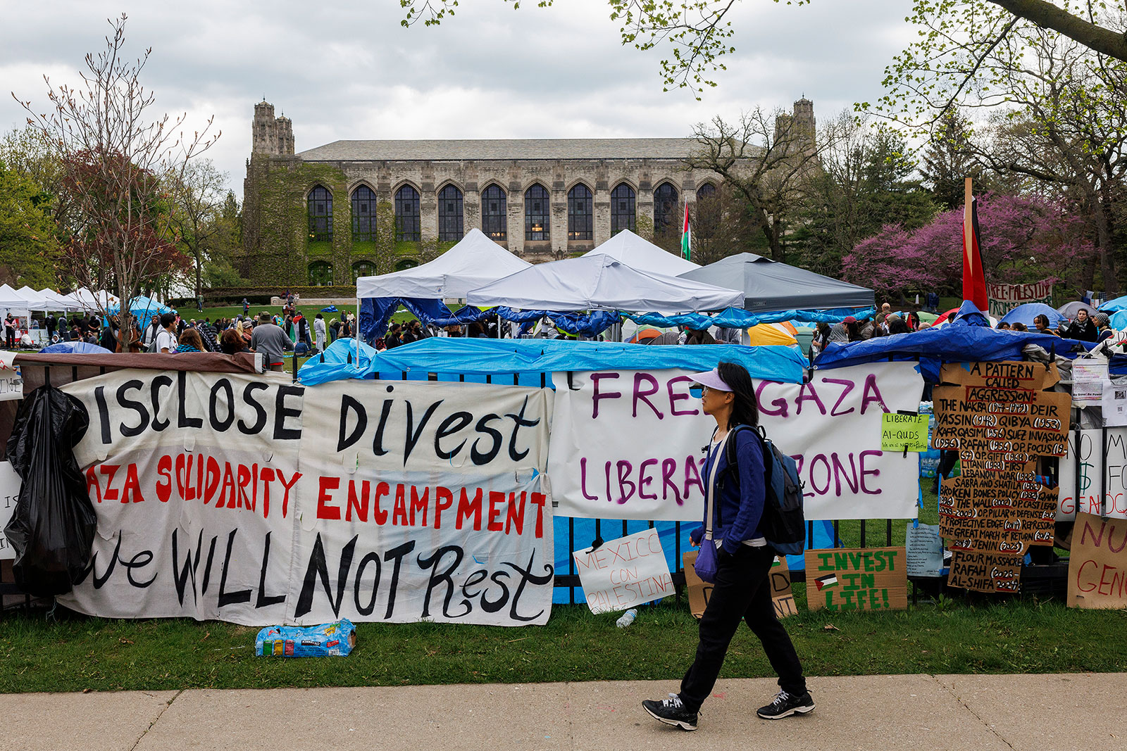 A person walks past a pro-Palestinian encampment at Northwestern University, on Sunday, April 28, in Evanston, Illlinois. 