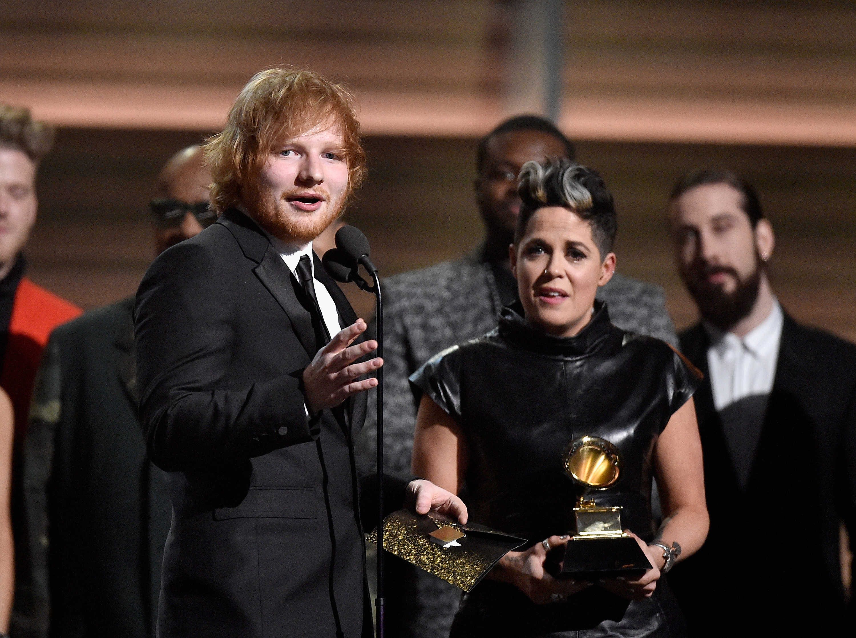 Ed Sheeran (L) and Amy Wadge accept award for Best Pop Solo Performance for 'Thinking Out Loud' onstage during The 58th Grammy Awards at Staples Center on February 15, 2016 in Los Angeles, California. 