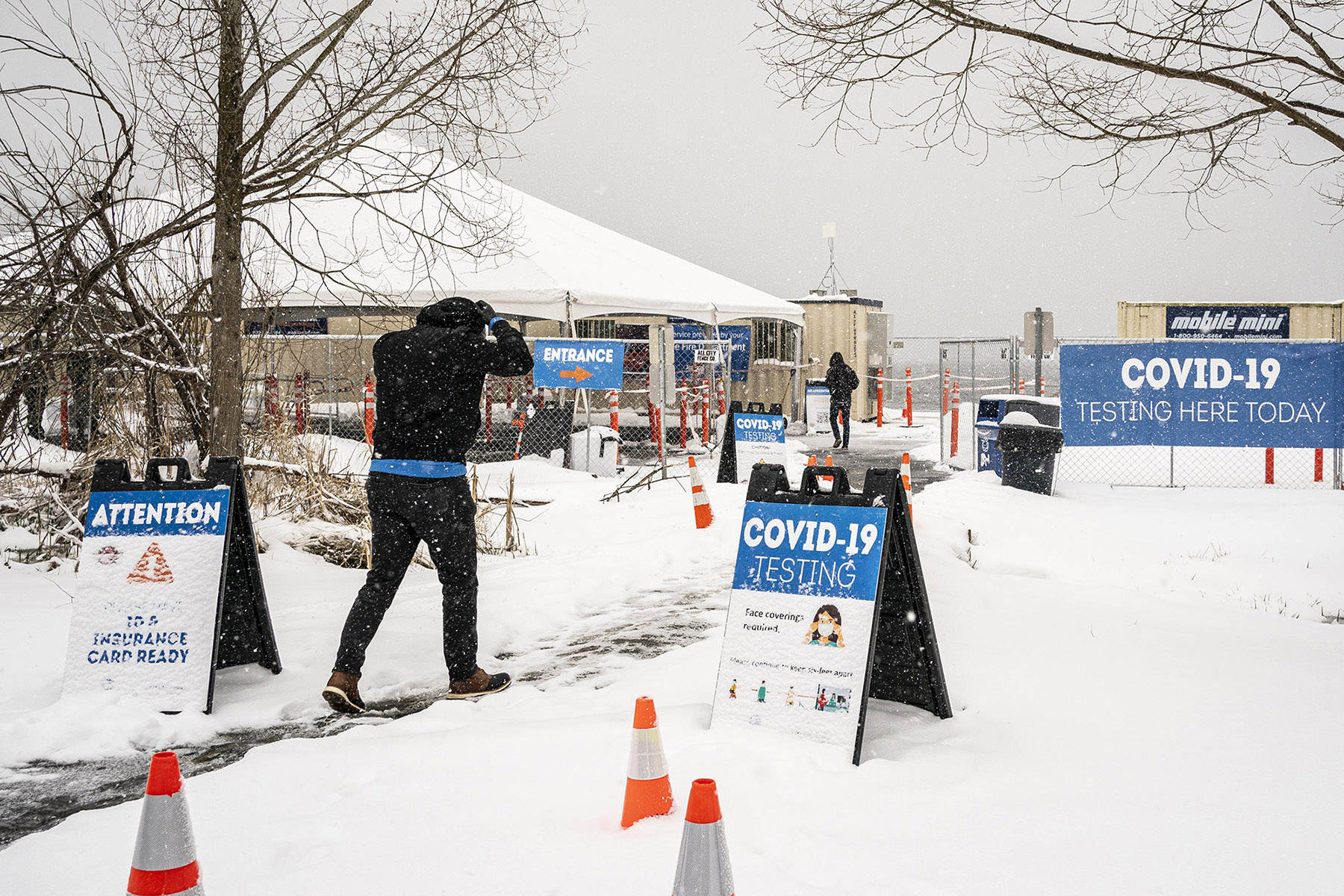 People enter a COVID-19 testing site on February 13, in Seattle, Washington. 