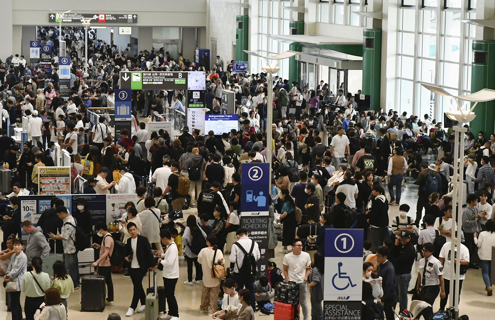 Naha airport in the southern Japan island prefecture of Okinawa is crowded on April 3, after operations were temporarily suspended following a tsunami warning due to a powerful earthquake off Taiwan. 