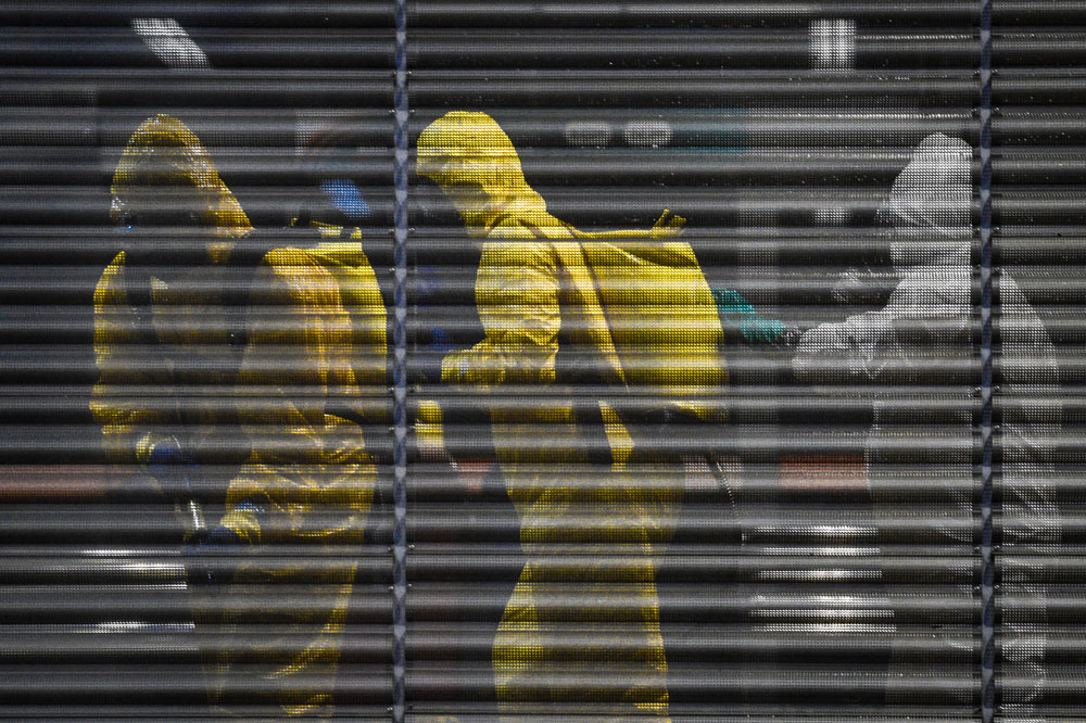 Authorities sanitize a bus station on April 9 in Belo Horizonte, Brazil.