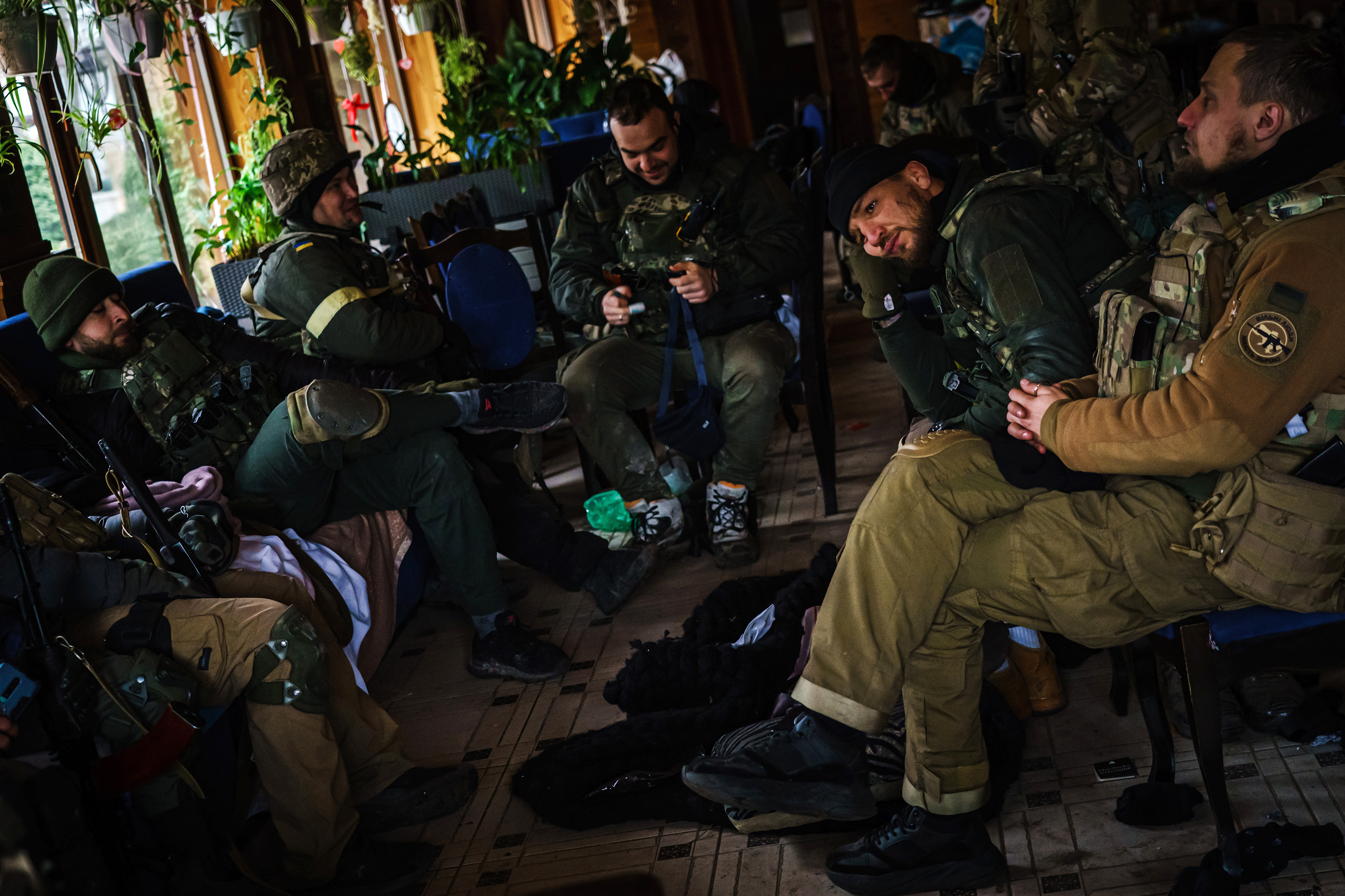 Yaroslav Amosov, second from right, rests with fellow Ukrainian soldiers in Irpin, Ukraine, on March 6. 