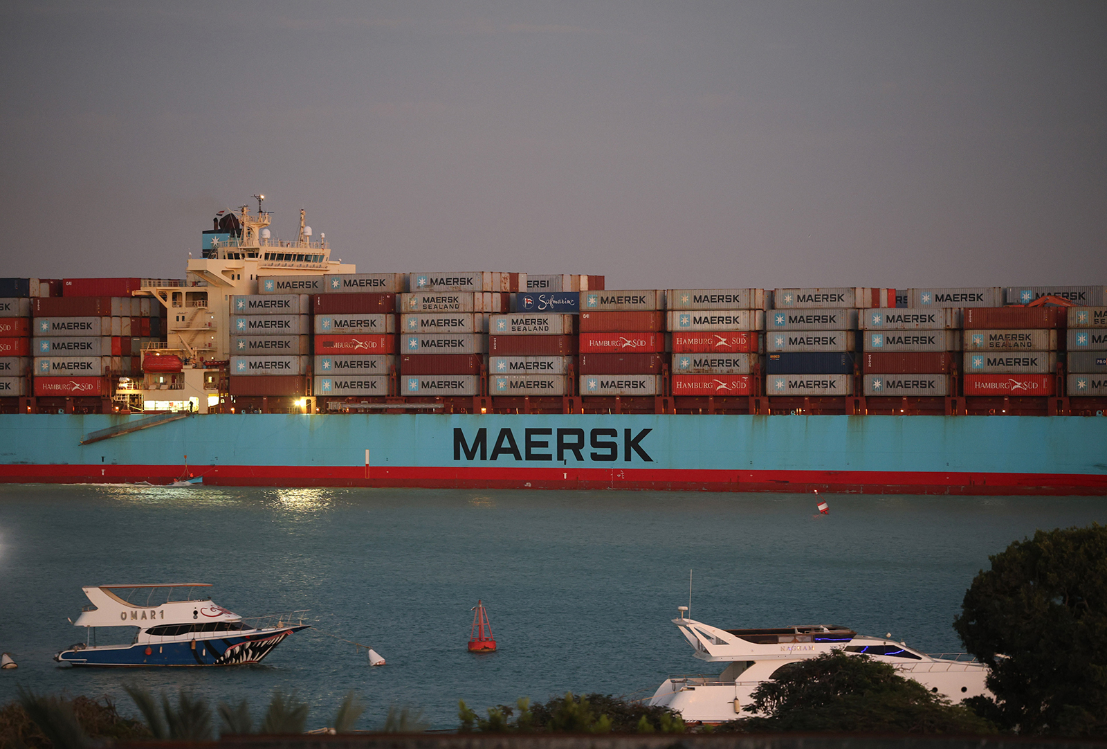The Maersk Sentosa container ship sails southbound to exit the Suez Canal in Suez, Egypt, on December 21.