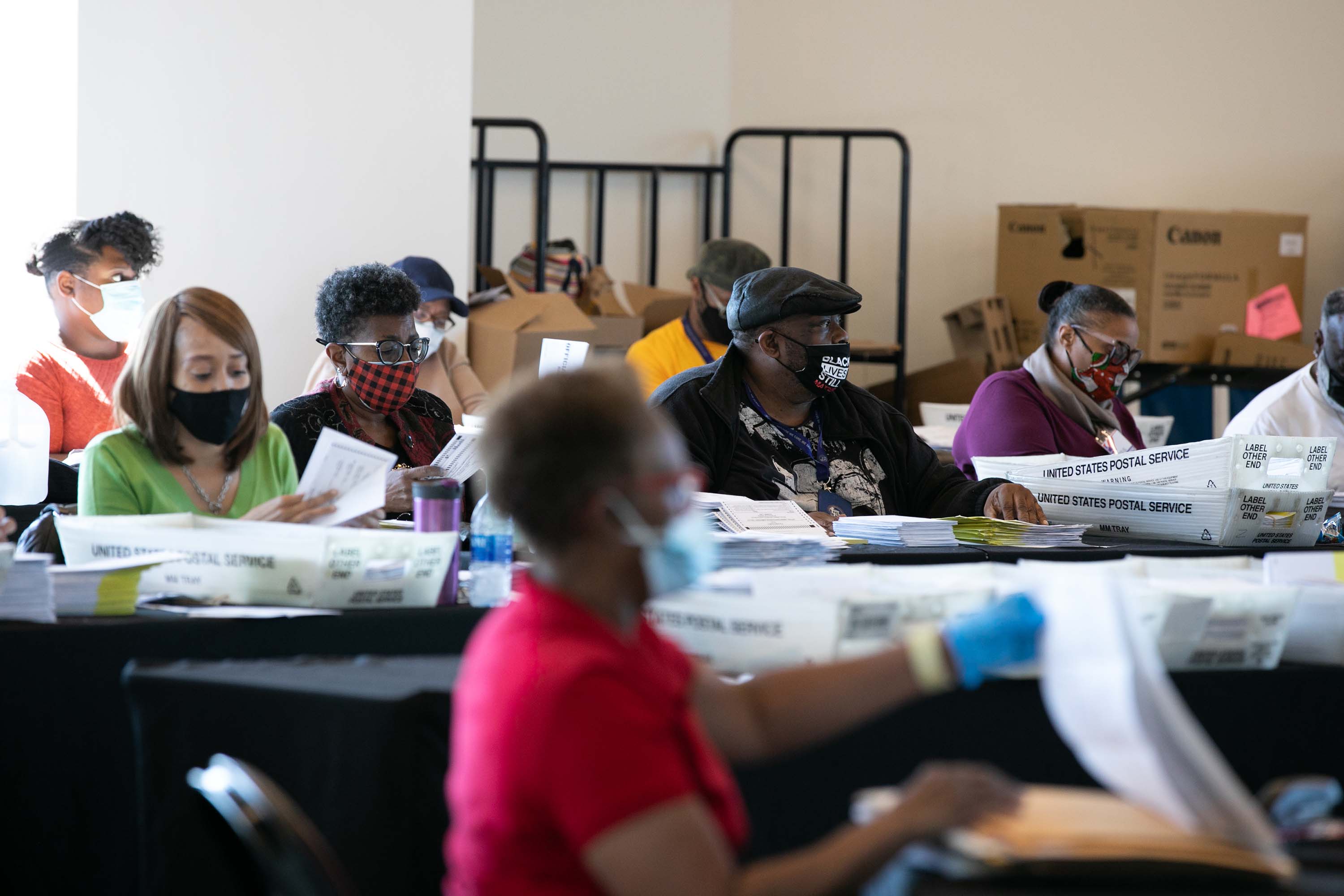 Election workers count Fulton County ballots at State Farm Arena in Atlanta, Georgia on November 4. 