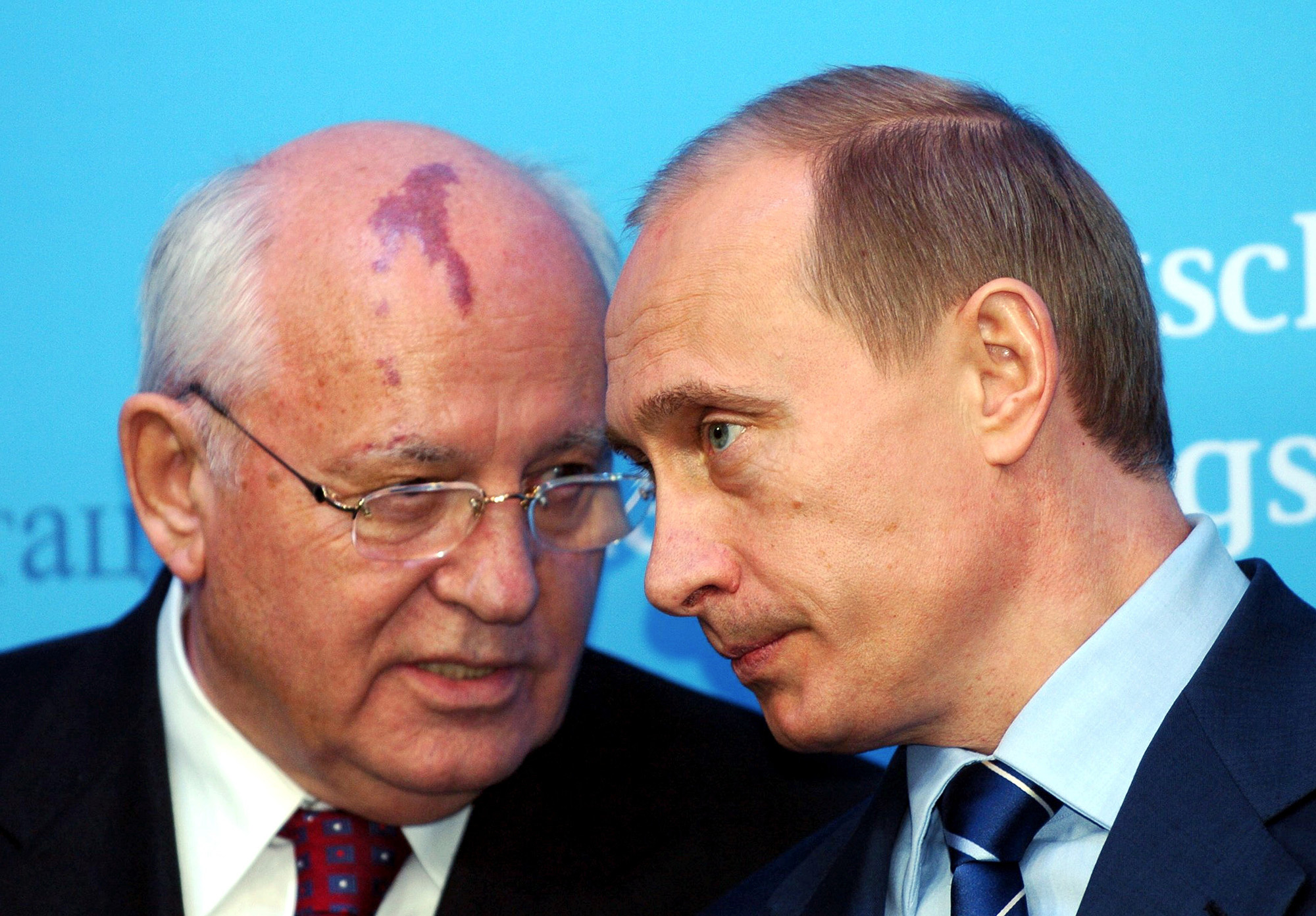 Russia's President Vladimir Putin, right, talks with former Soviet President Mikhail Gorbachev at the start of a news conference at the Castle of Gottorf in Schleswig, northern Germany, Tuesday, Dec. 21, 2004. 