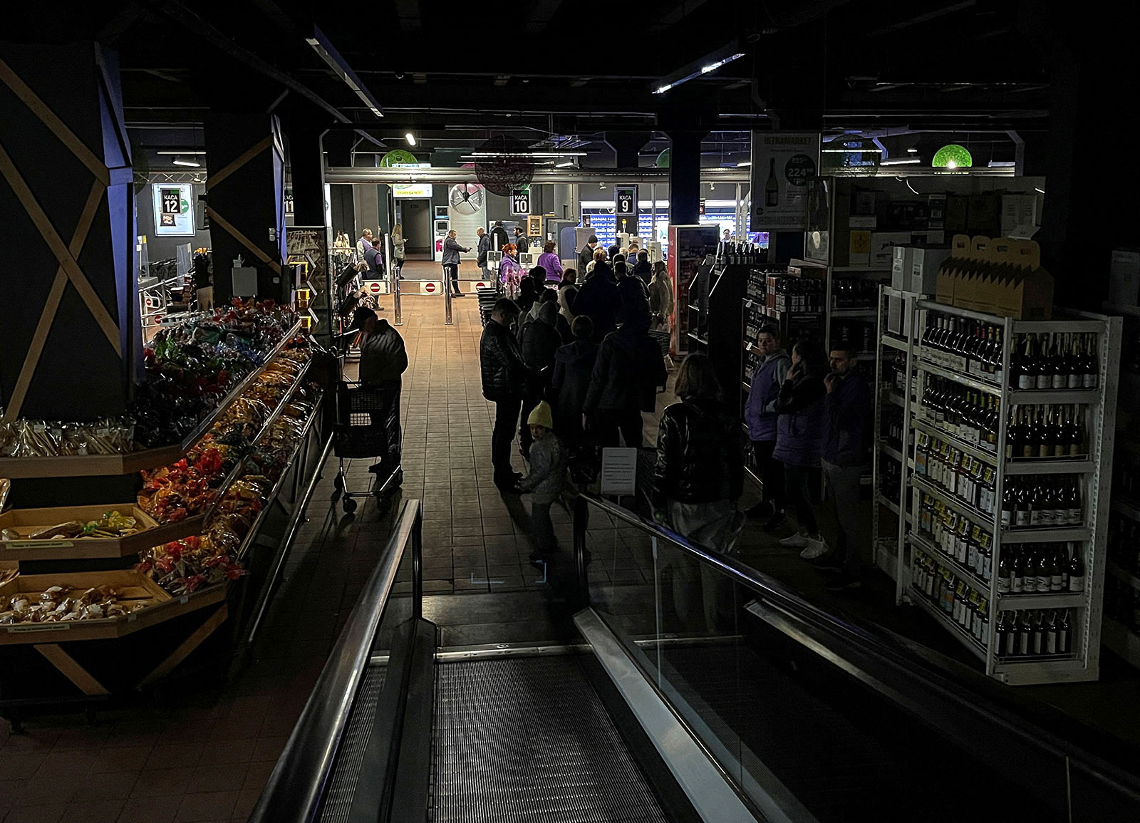 People visit a supermarket without electricity after a Russian missile attack in Kyiv, Ukraine, on October 22. 