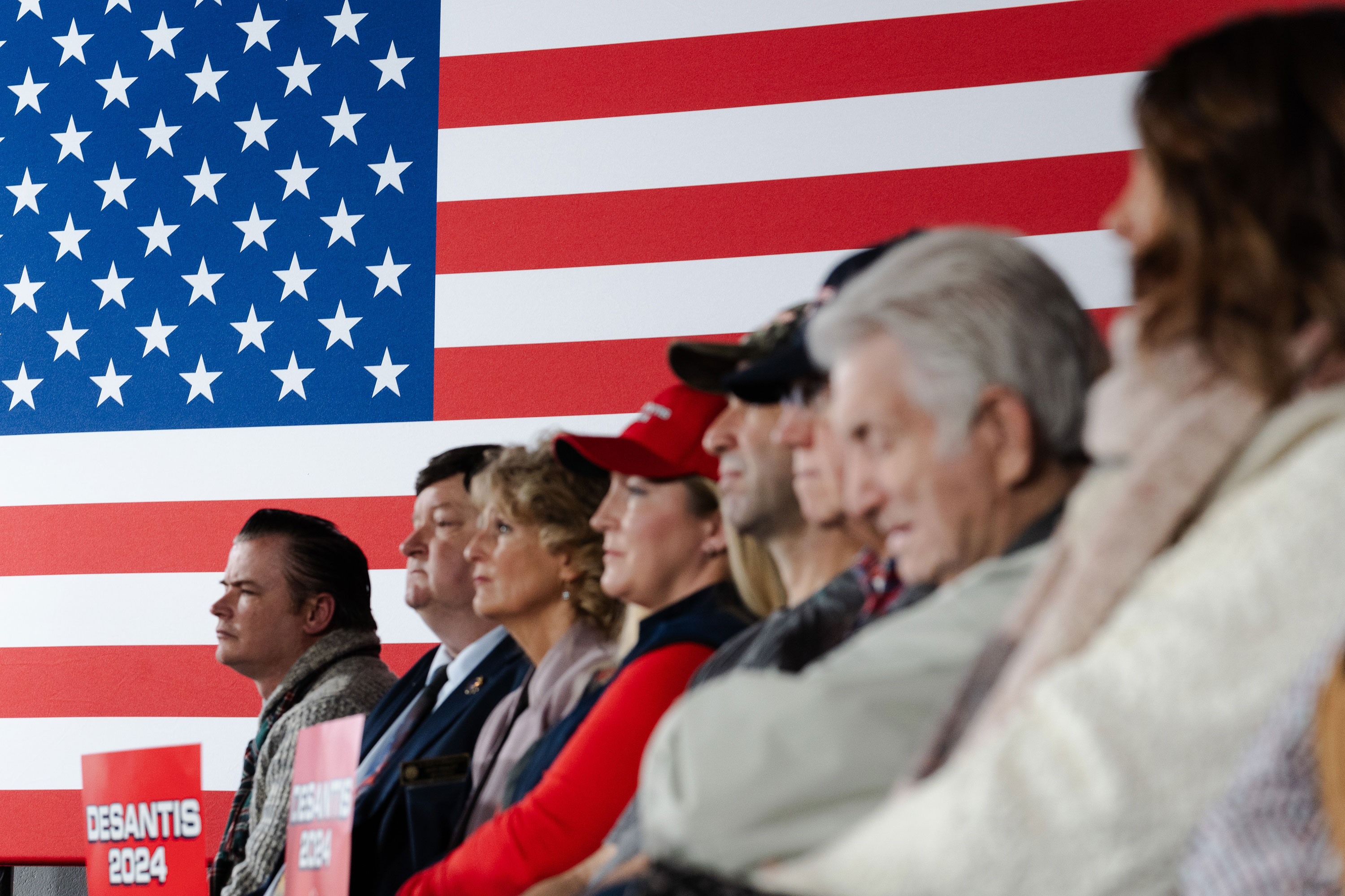 People listen during a campaign event with Ron DeSantis in Manchester, New Hampshire, on December 30.