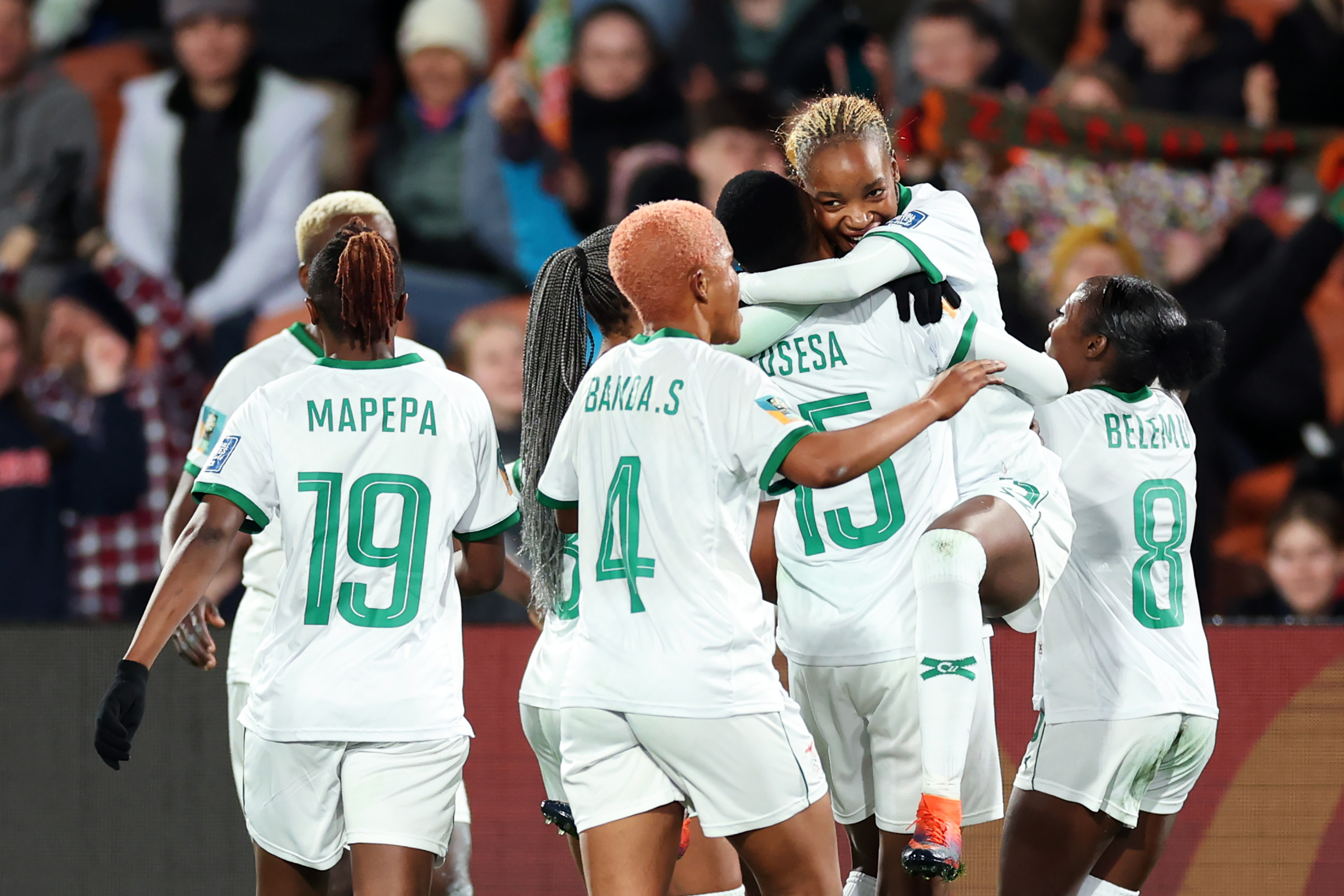 Racheal Kundananji of Zambia celebrates with teammates after scoring her team's third goal during the match between Costa Rica and Zambia at Waikato Stadium in Hamilton, New Zealand, on July 31. 