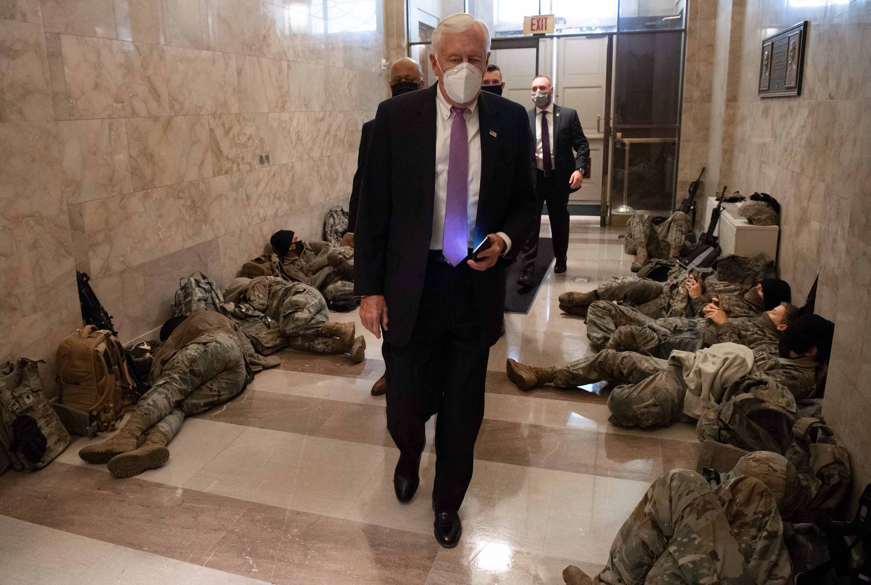 House Majority Leader Steny Hoyer walks past members of the National Guard as he arrives at the US Capitol in Washington, DC, on January 13. 