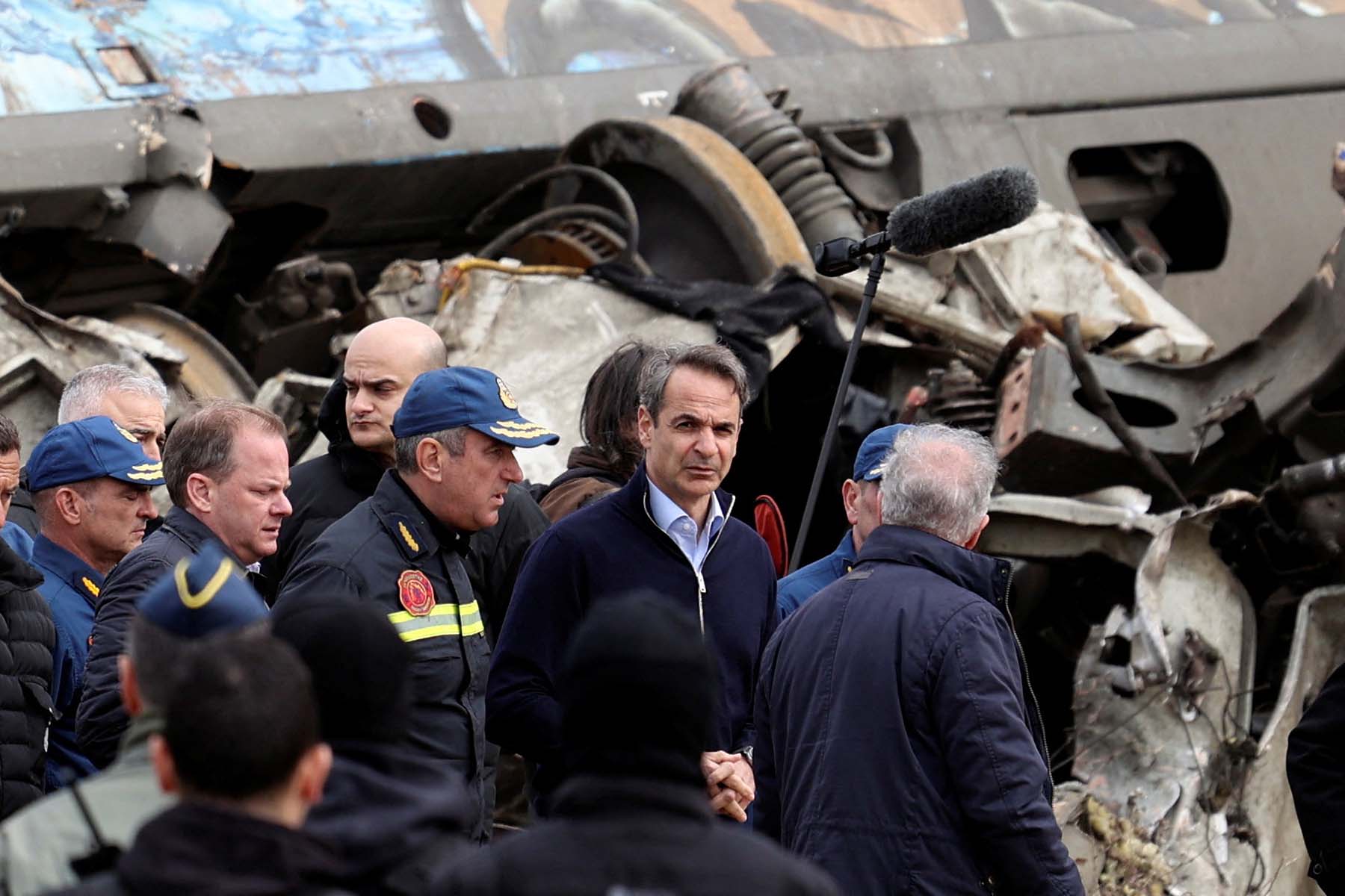 Greek Prime Minister Kyriakos Mitsotakis, center, visits the site where two trains collided, near the city of Larissa, Greece, on March 1. 