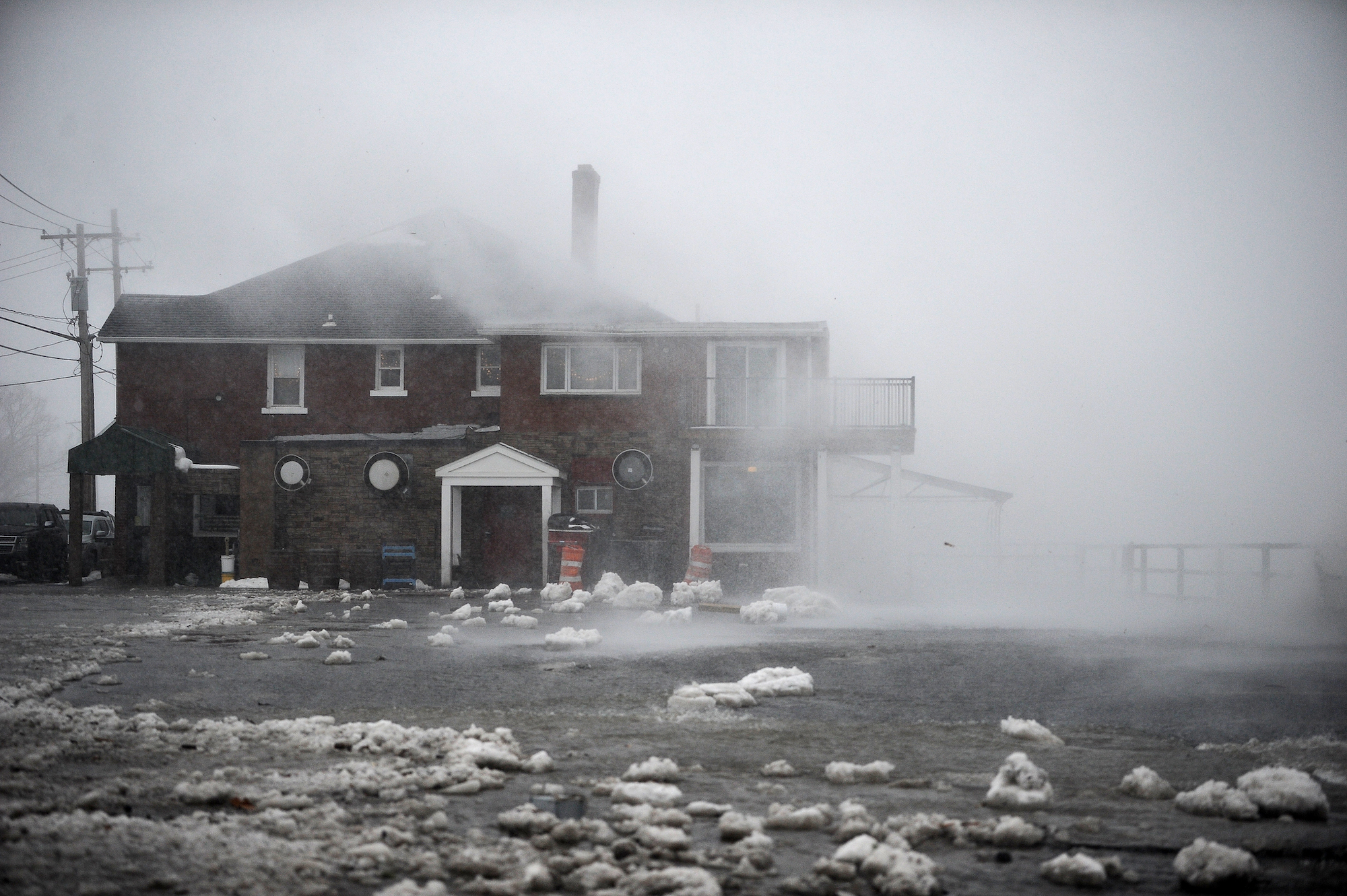 Lake Erie waters wash over the shoreline on in Hamburg, New York on Friday.