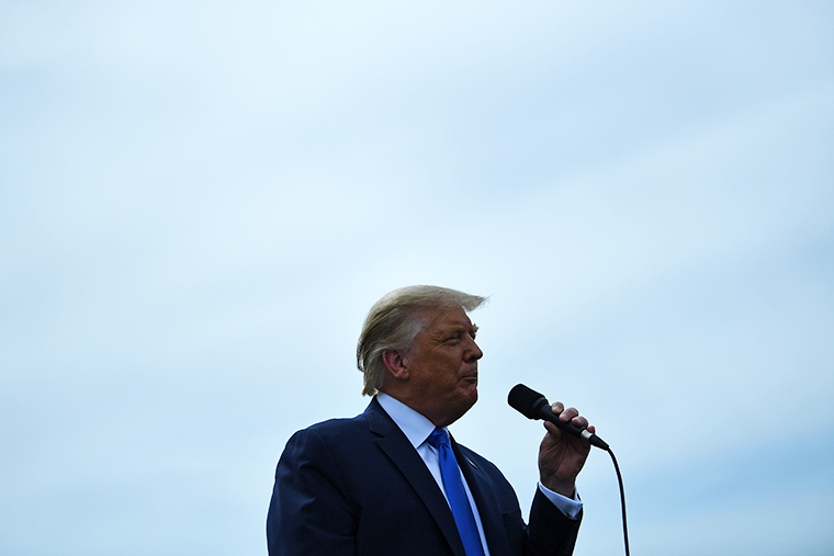 US President Donald Trump addresses supporters on the tarmac at Asheville Regional Airport in Fletcher, North Carolina. on August 24, 2020.