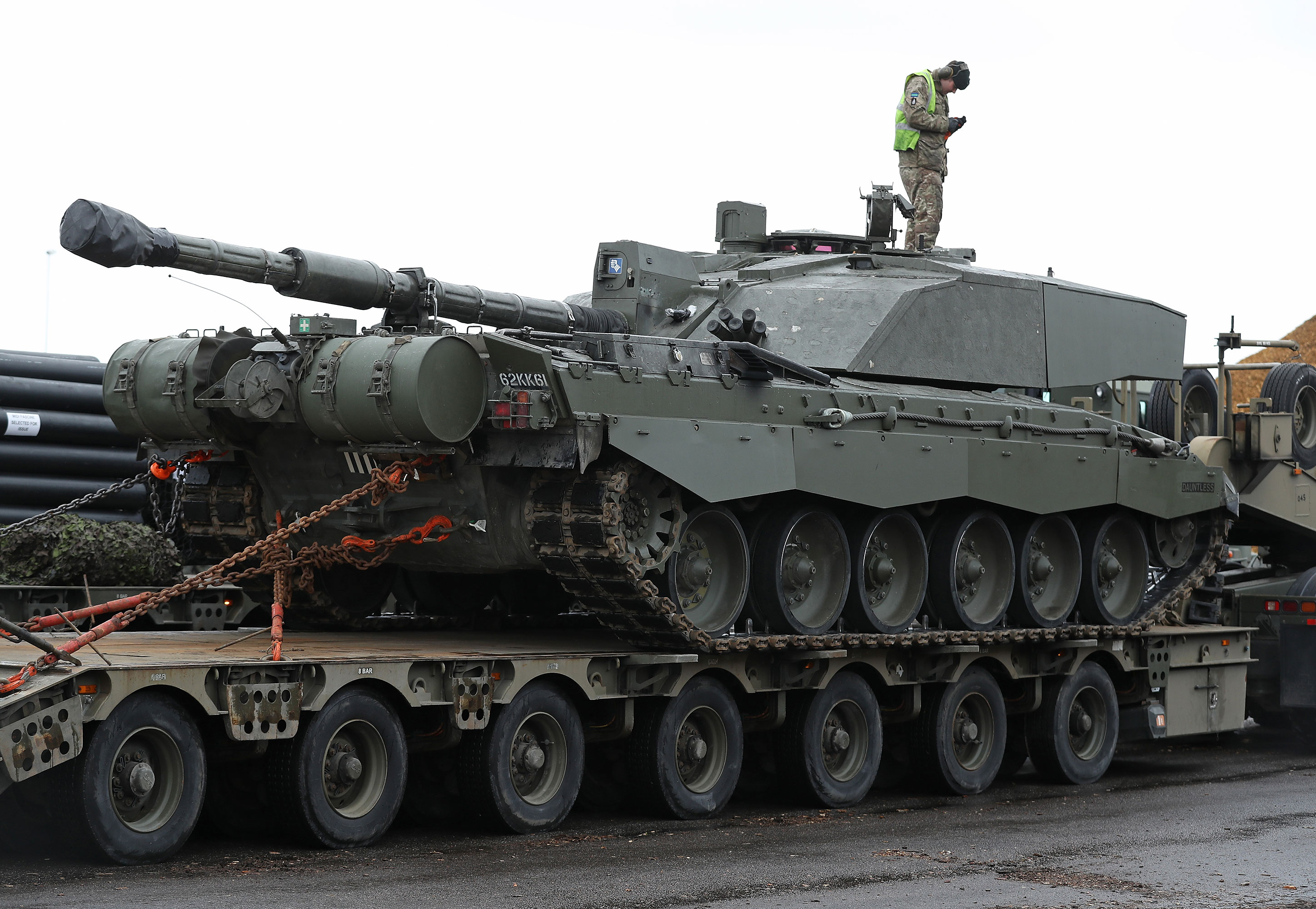 A British Army tank driver descends from a Challenger 2 tank March 22, 2017 in Paldiski, Estonia. 