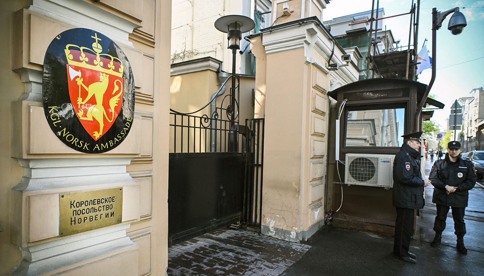 Russian police officers stand guard outside the Norwegian embassy in Moscow, on April 26. 