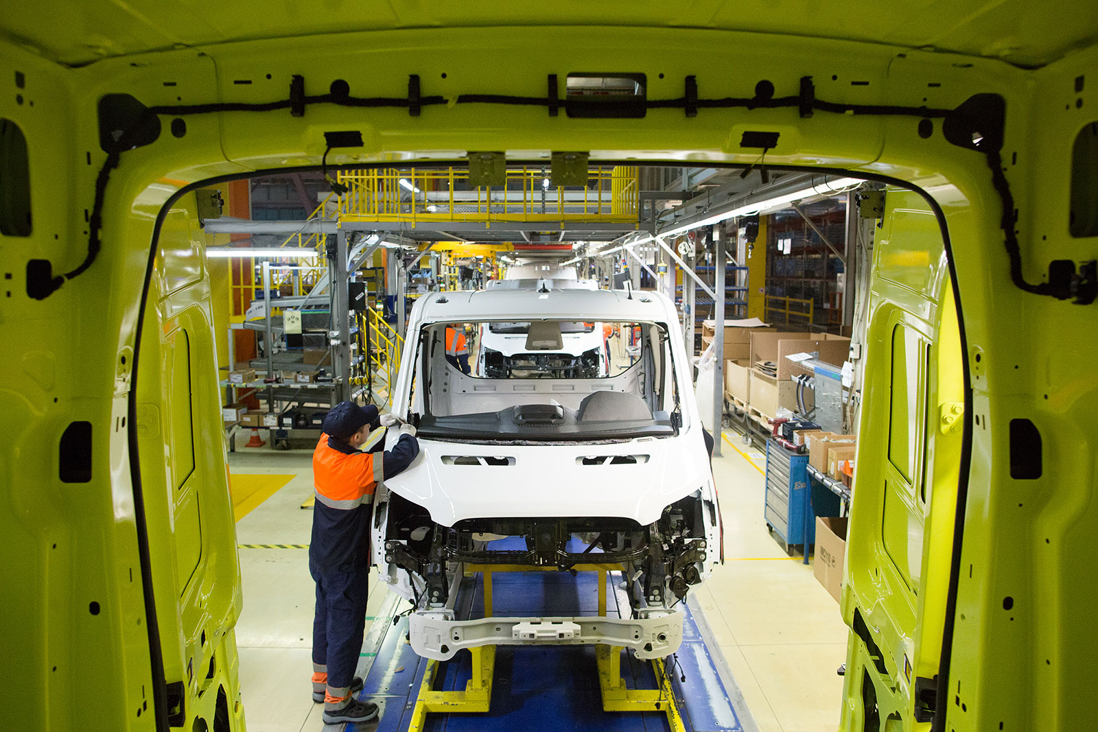 A worker installs components on a Ford Transit van at the Ford Sollers production plant in Elabuga, Russia, in 2020.