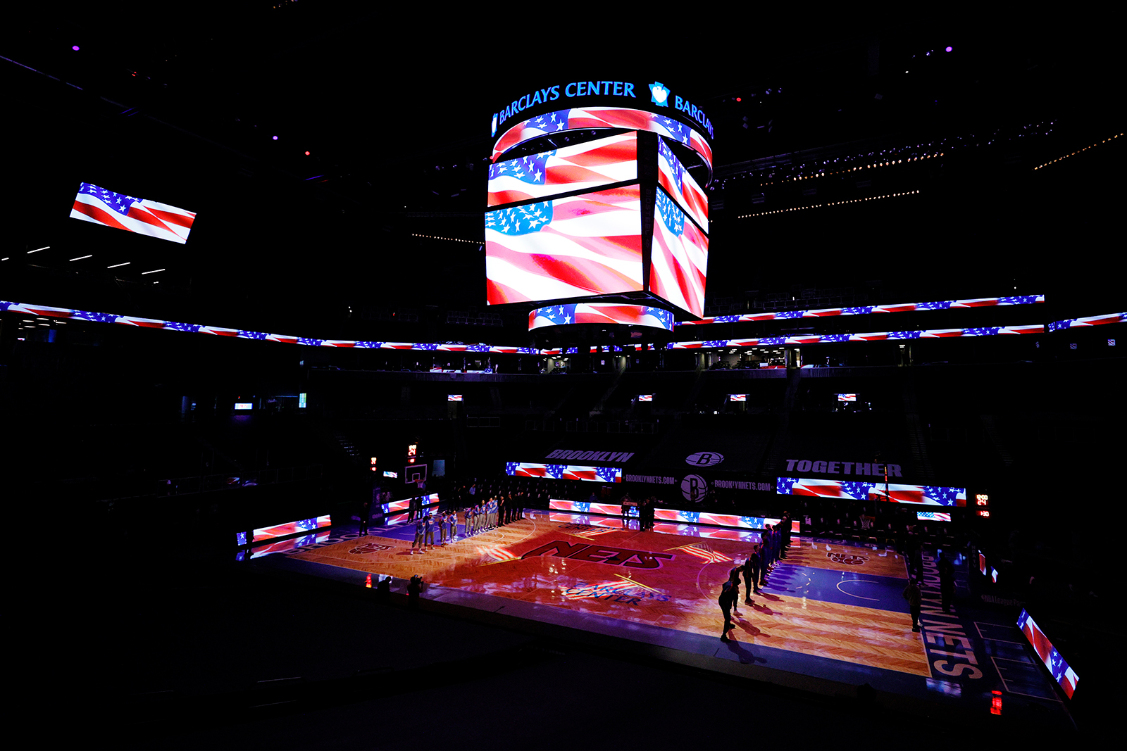 The Brooklyn Nets and the Philadelphia 76ers stand for the national anthem before the first half at Barclays Center in Brooklyn, New York, on January 7.
