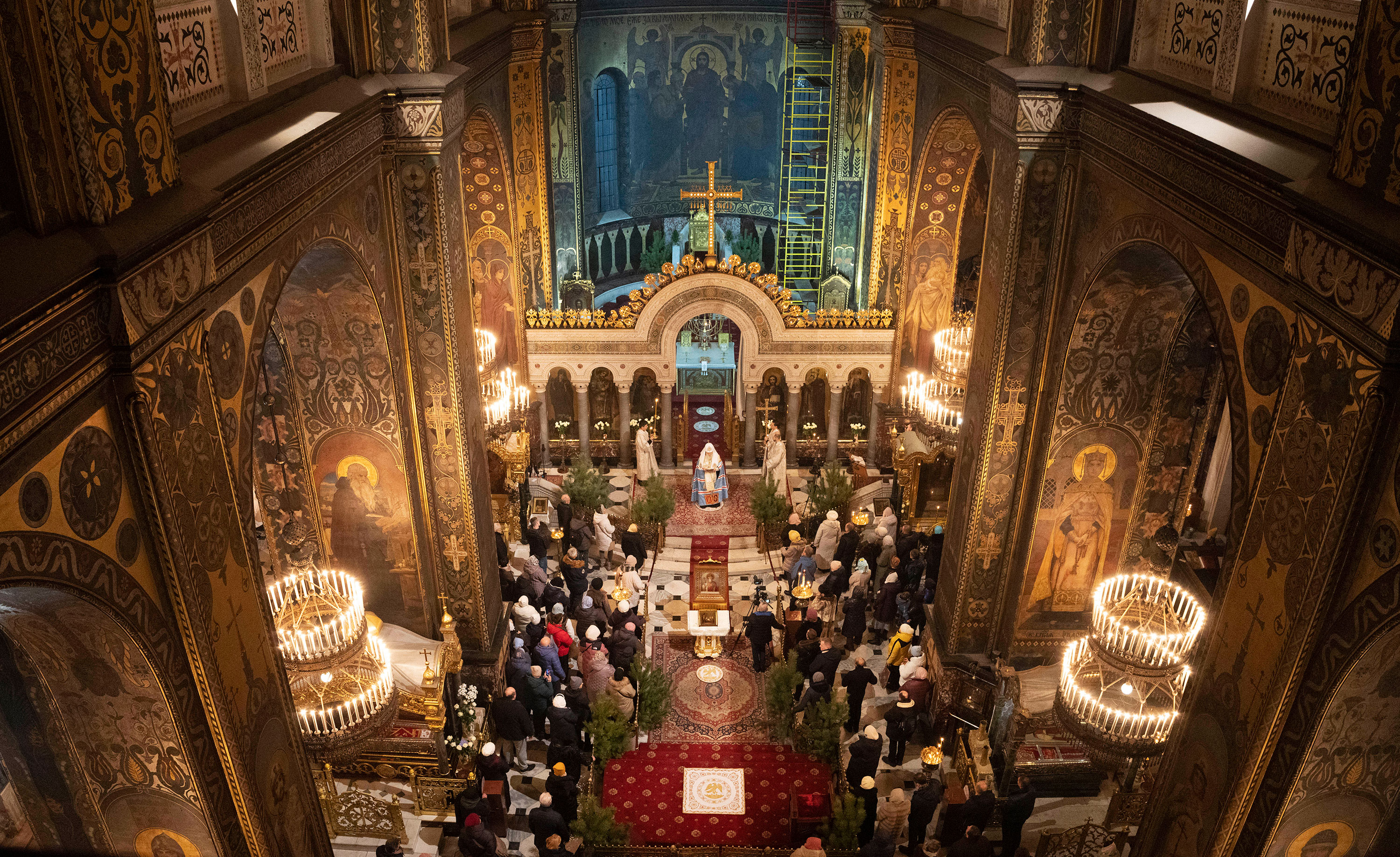 People pray in St. Volodymyr's Cathedral on Orthodox Christmas Eve in Kyiv on Friday.