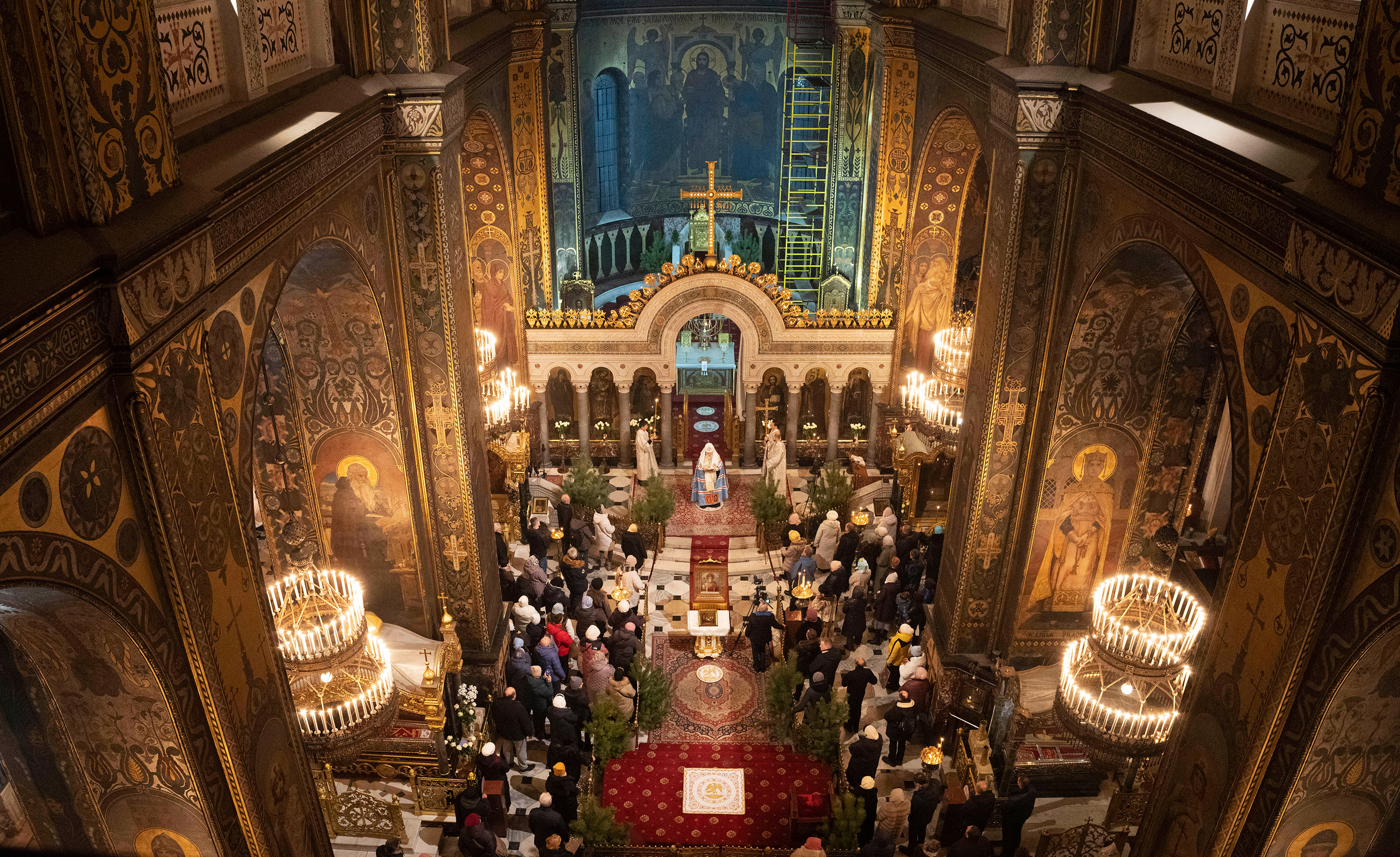 People pray in St. Volodymyr's Cathedral on Orthodox Christmas Eve in Kyiv on Friday.
