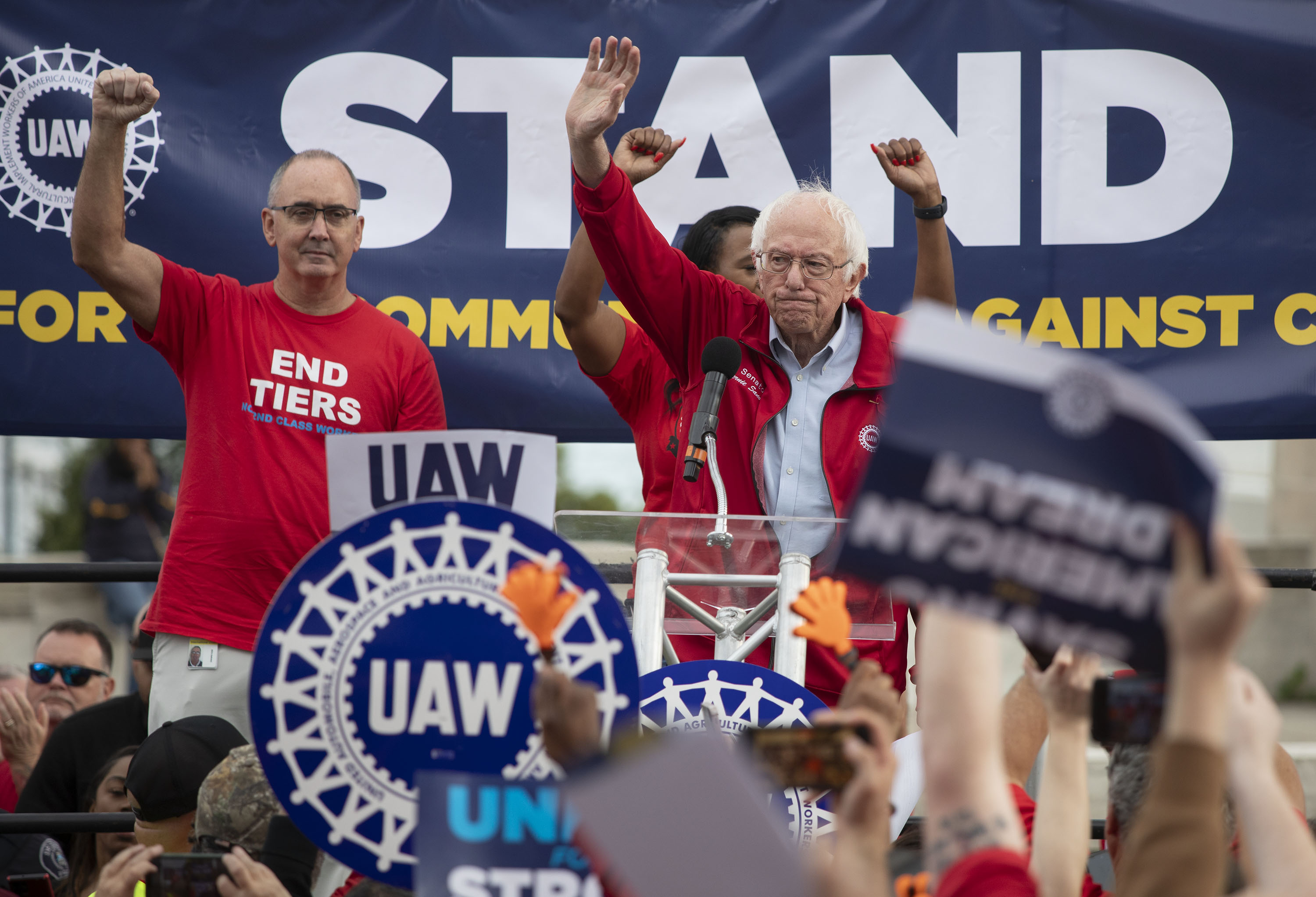 Bernie Sanders and UAW President Shawn Fain, left, speak at a rally in support of United Auto Workers members as they strike in Detroit, Michigan, on September 15.