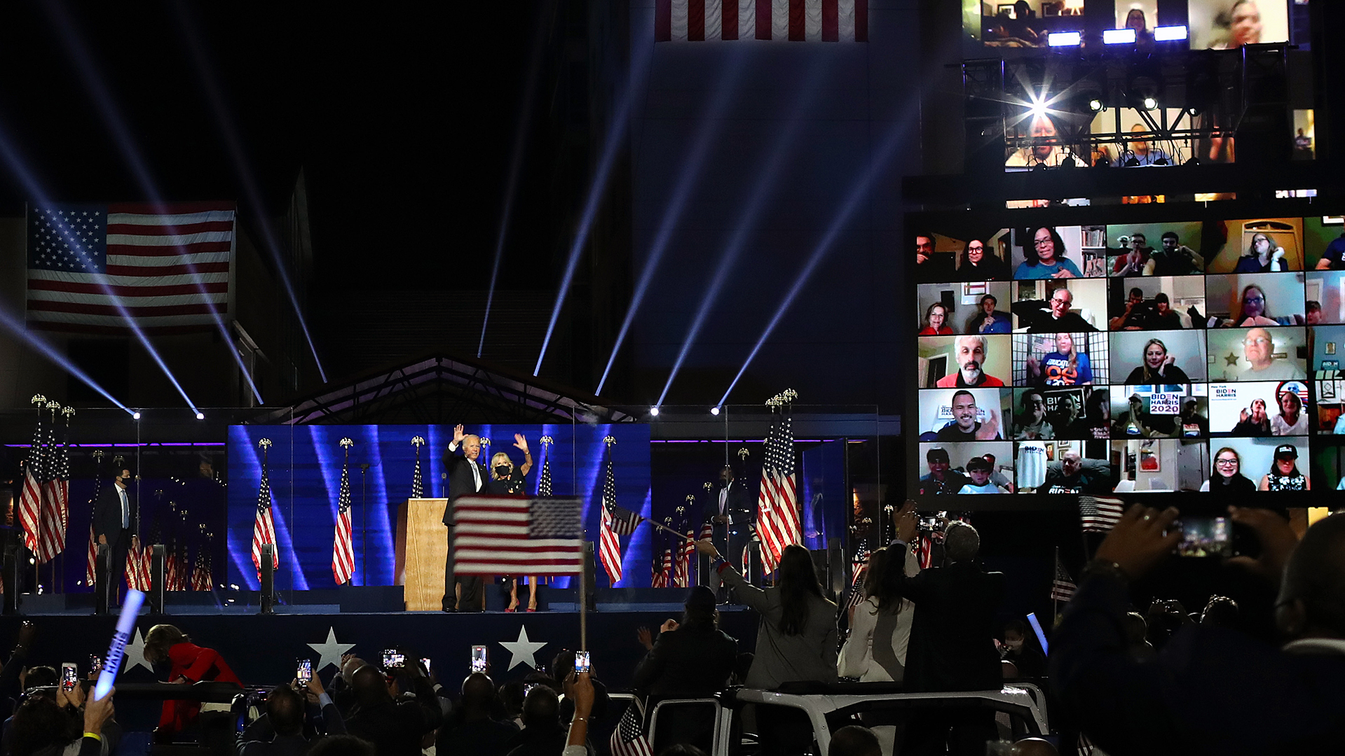 In this November 2020 photo, President-elect Joe Biden and Jill Biden wave to the crowd after Biden's address to the nation from the Chase Center in Wilmington, Delaware. 