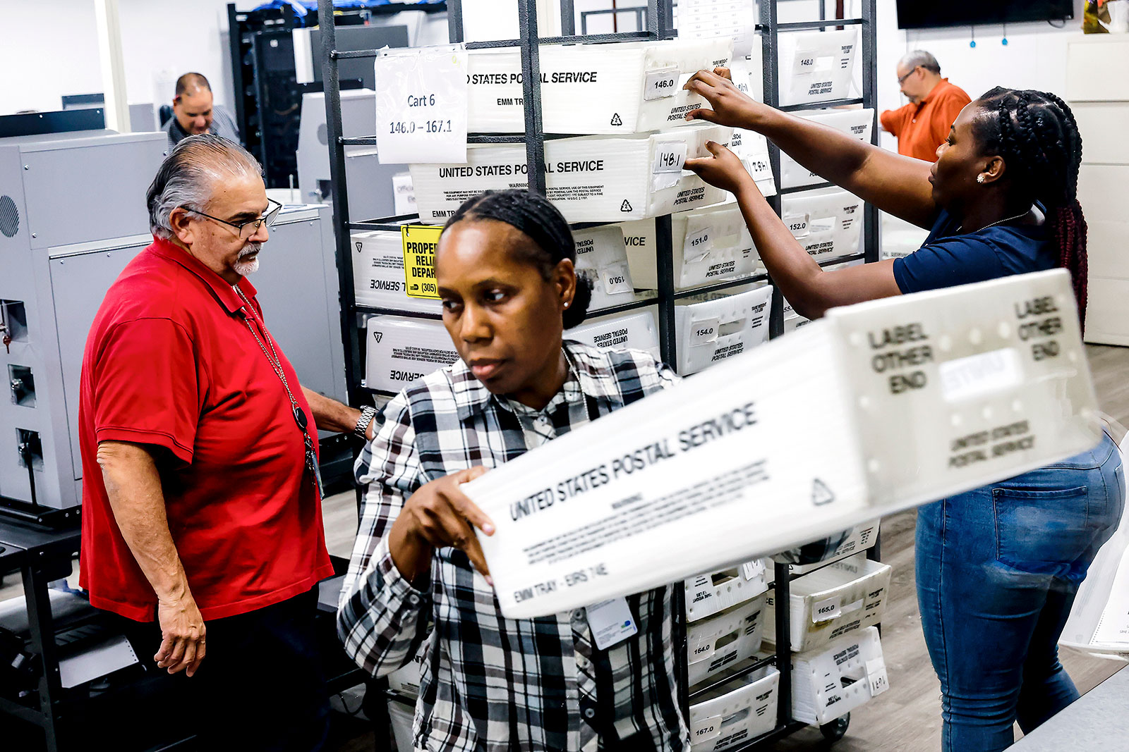 Election workers count primary ballots in Doral, Florida, on Aug. 23.