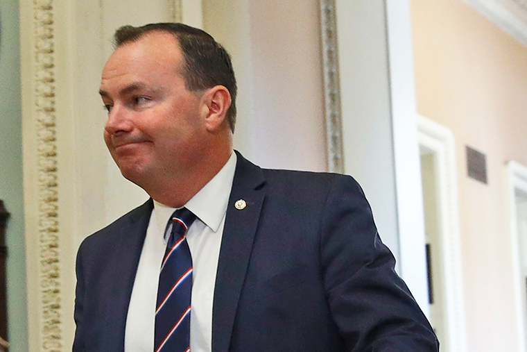 Sen. Mike Lee walks to the Senate chamber for the impeachment trial.