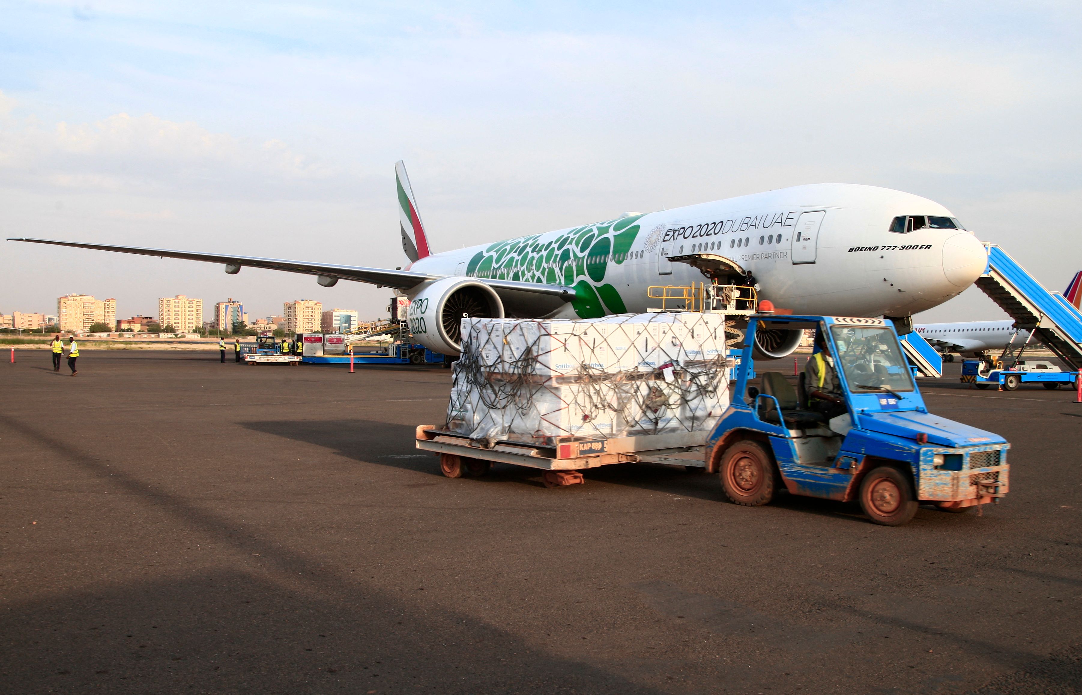 A shipment of vaccines against the coronavirus sent to Sudan by the Covax vaccine-sharing initiative, are unloaded shortly after an Emirates plane landed at the airport in the capital Khartoum, on October 6, 2021. 