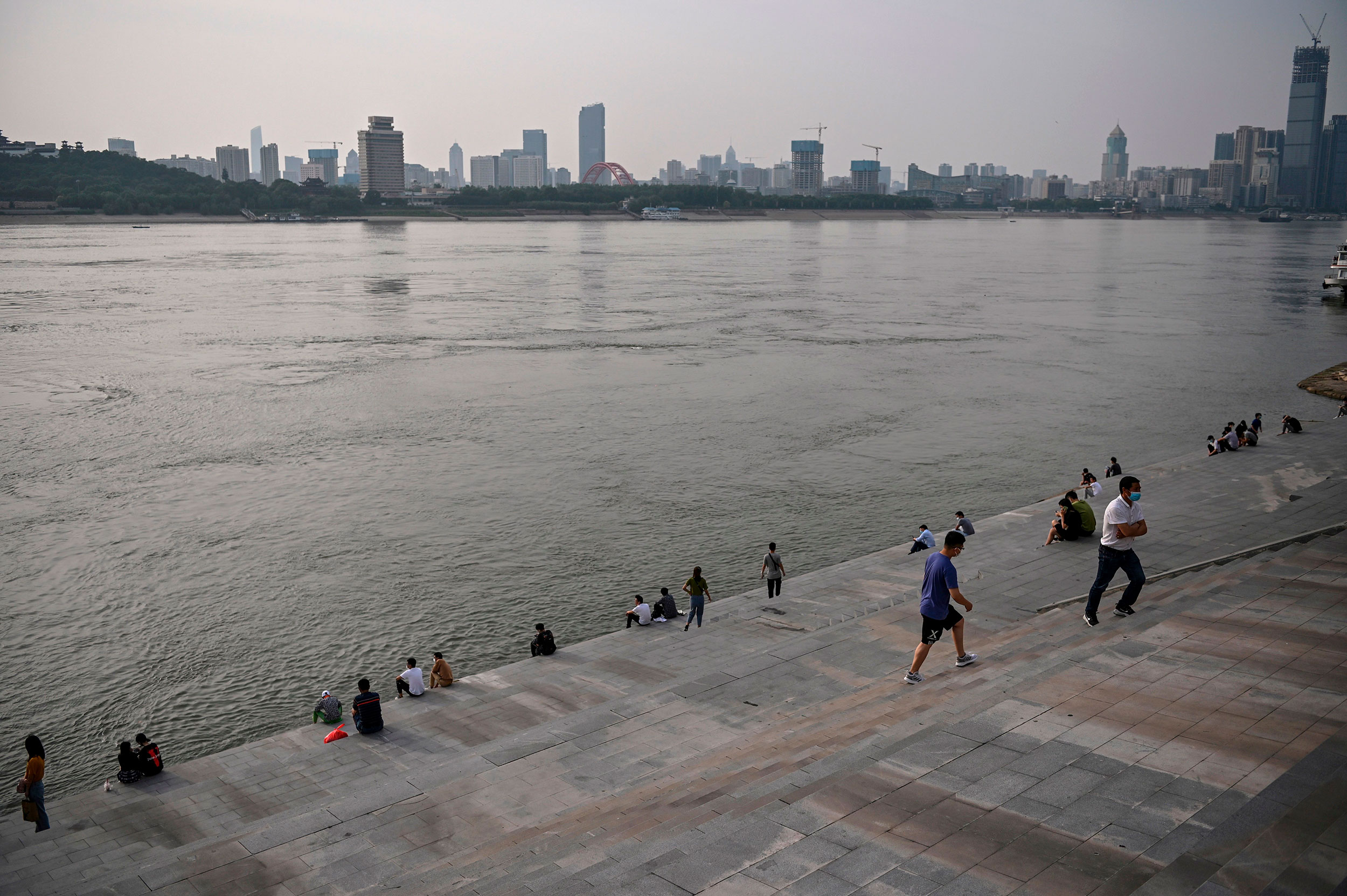Residents congregate near the Yangtze River on May 16 in Wuhan, China.