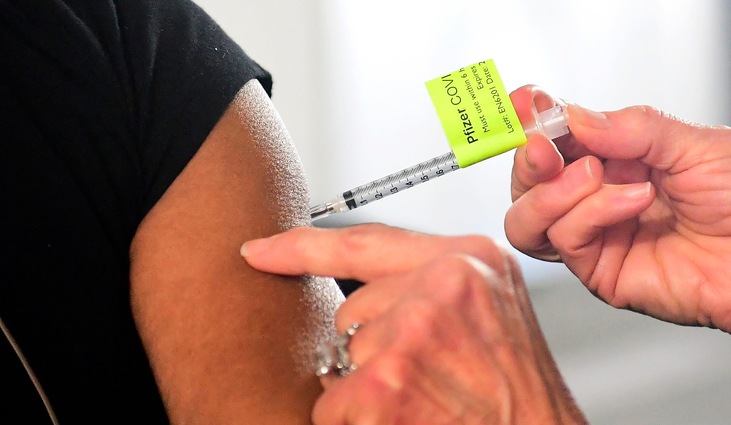 A dose of the Pfizer Covid-19 vaccine is administered at Cal Poly Pomona University in Pomona, California, on February 5. 