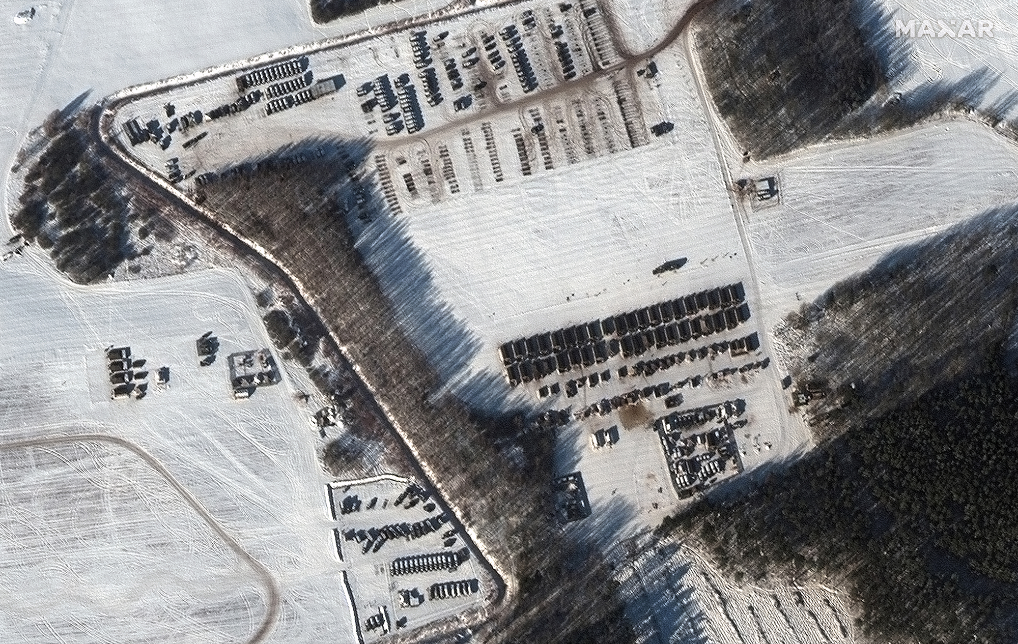 This satellite image provided by Maxar Technologies shows a troop housing area and vehicle park in Rechitsa, Belarus on February 4. Russia has moved troops from Siberia and the Far East to Belarus for sweeping joint drills. 