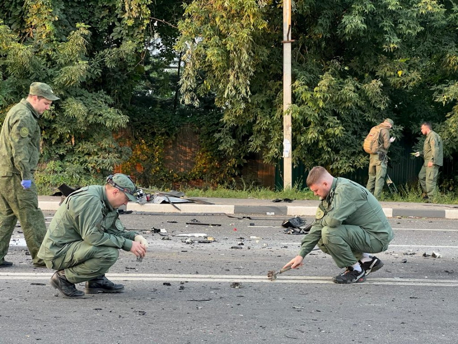 This state handout image shows investigators working at the site of a suspected car bomb attack that killed Darya Dugina in the Moscow region, Russia, on August 21.