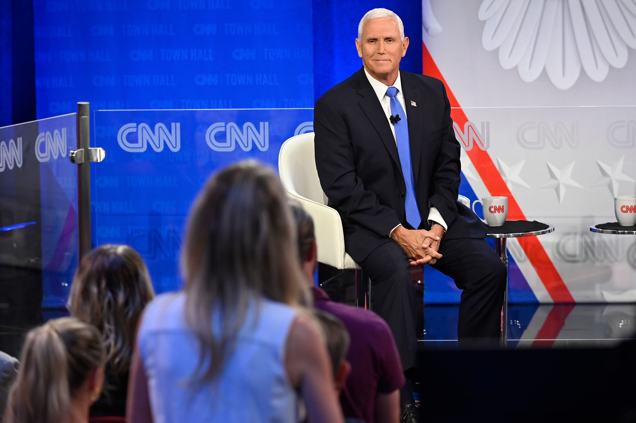 Mike Pence smiles as an audience member asks a question during the town hall on June 7, 2023.