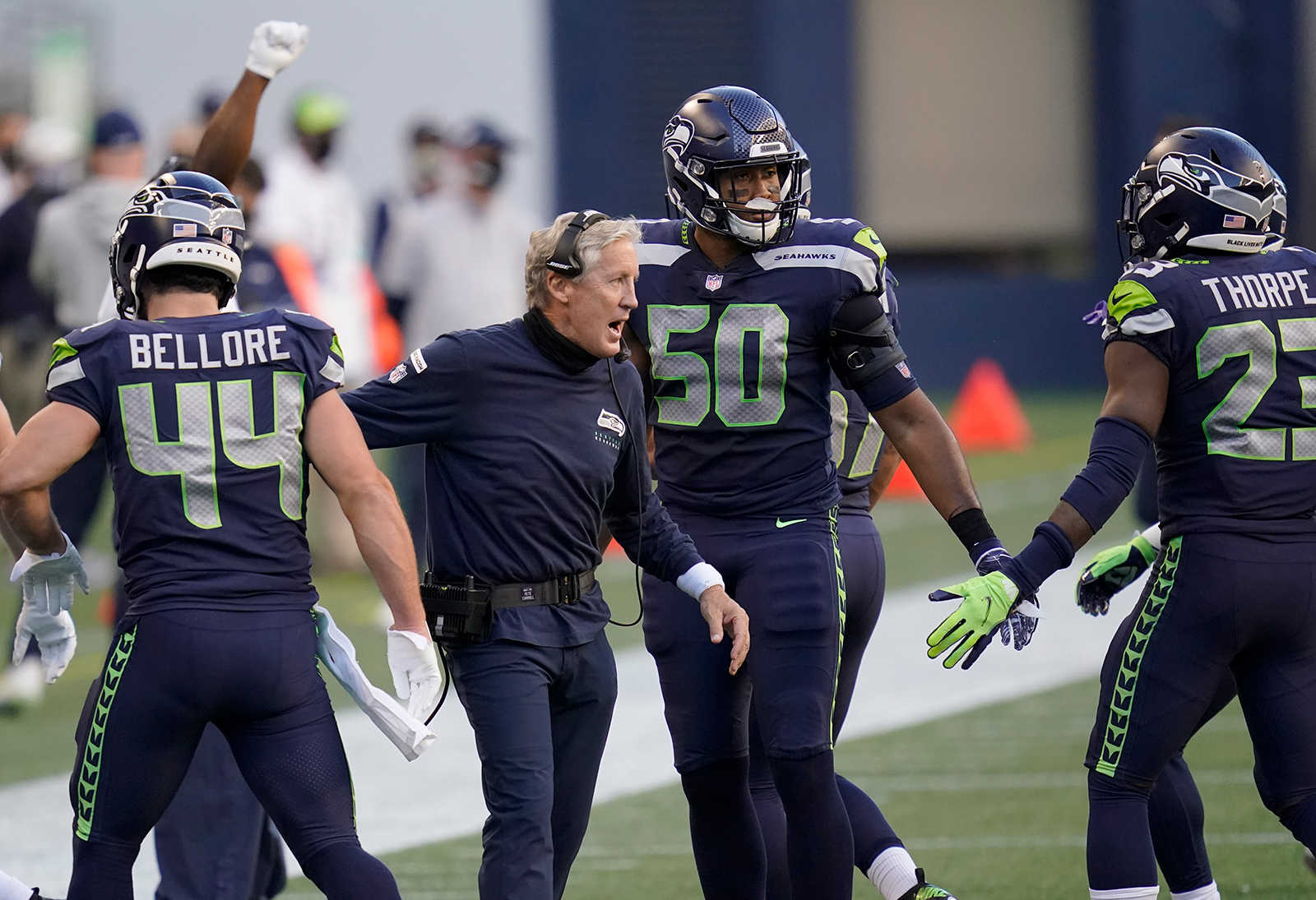 Seattle Seahawks head coach Pete Carroll celebrates with outside linebacker K.J. Wright (50) after wide receiver DK Metcalf scored a touchdown against the New England Patriots during the first half of an NFL football game, in Seattle, on September, 20.