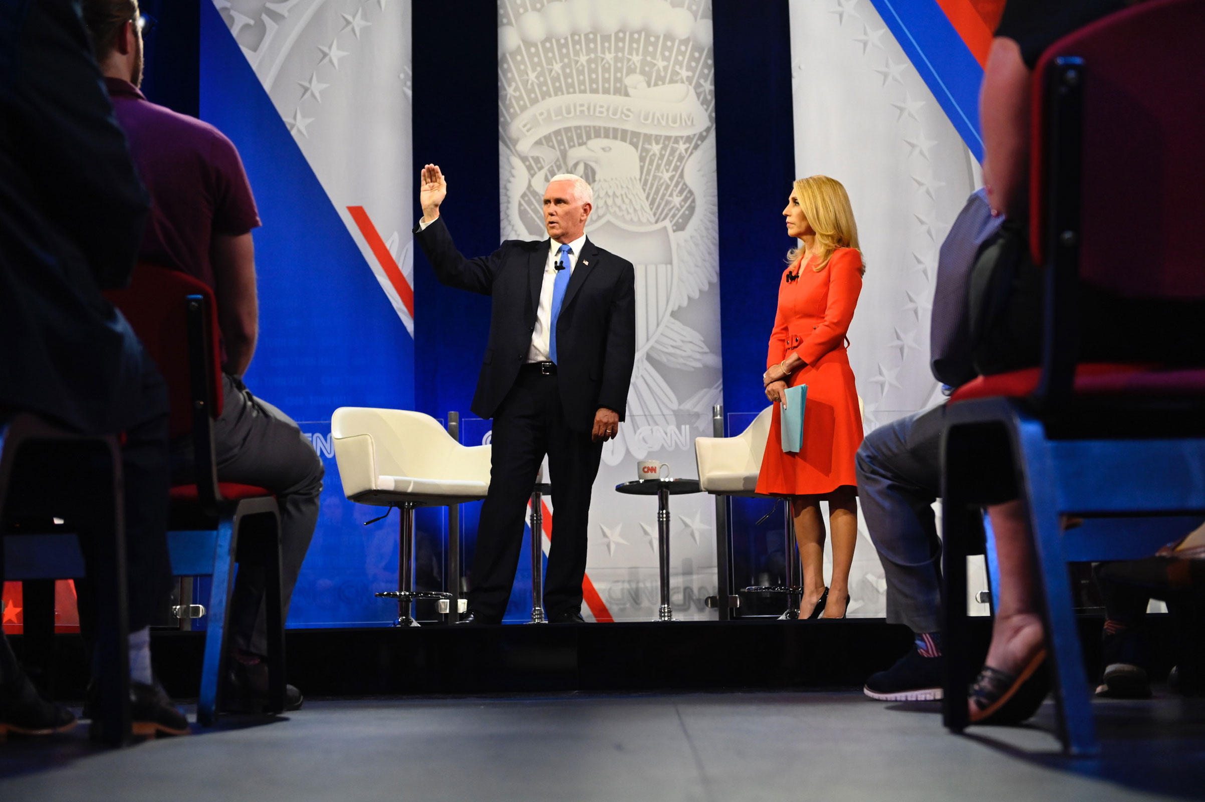 Mike Pence gestures while answering a question while on stage with CNN's Dana Bash.