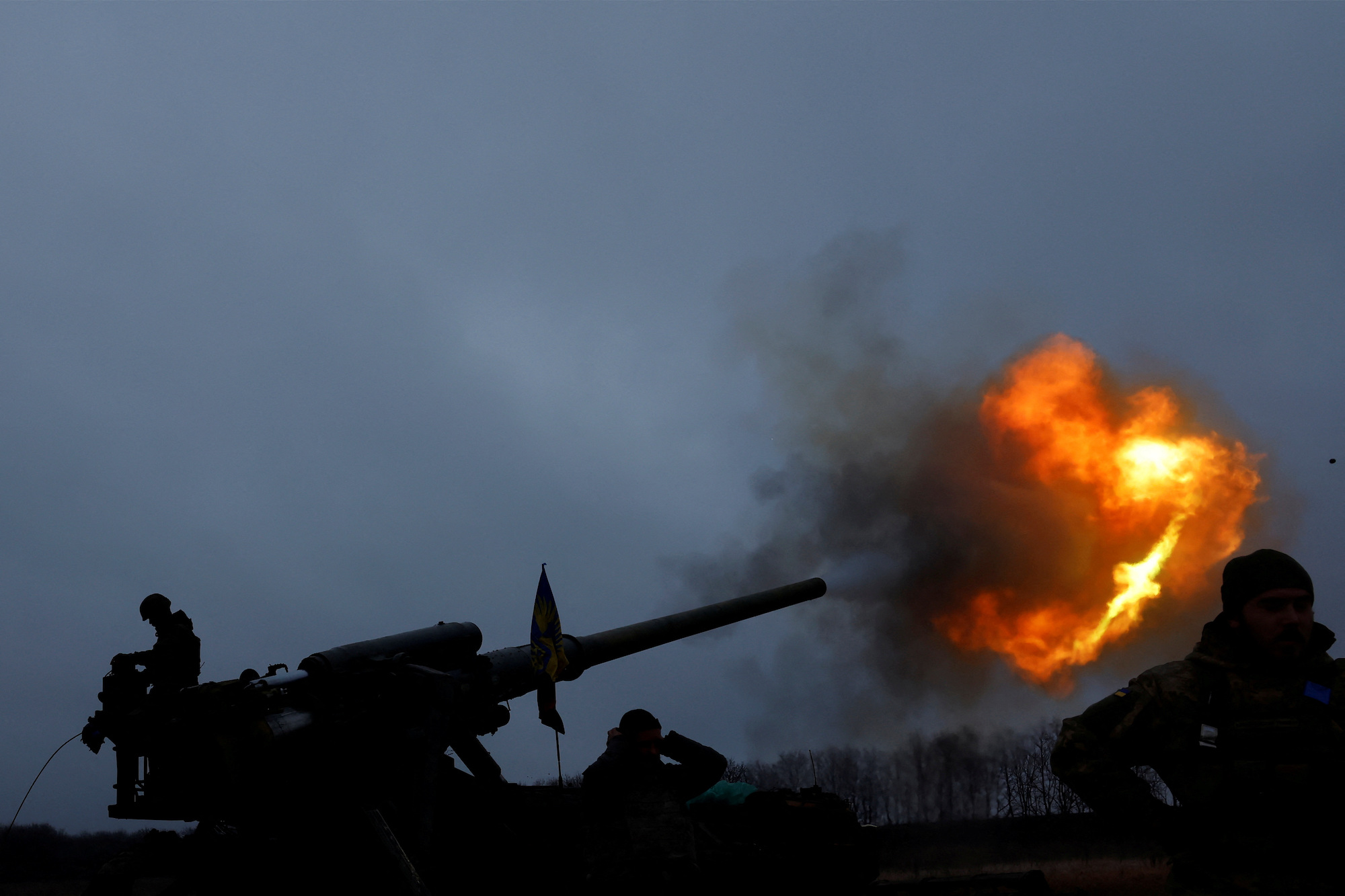 Ukrainian soldiers fire a projectile from a self-propelled cannon on the front line in Bakhmut on December 26, 2022.