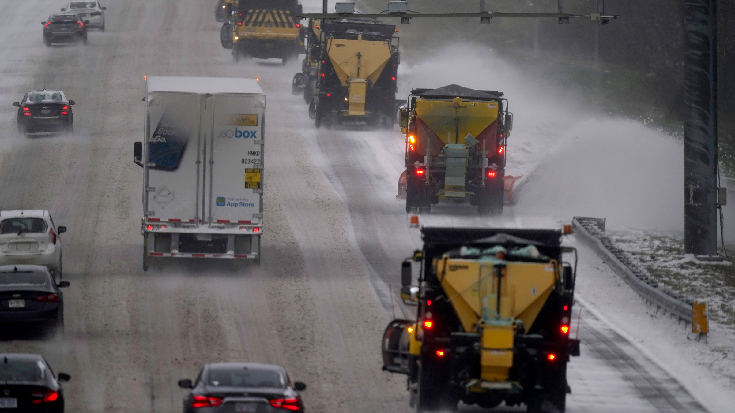 Vehicles navigate hazardous driving conditions along an interstate highway in Mebane, North Carolina, on Sunday.