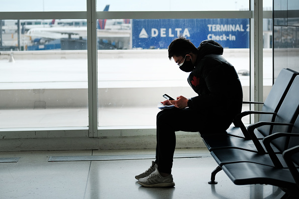 A traveler wears a mask at New York's John F. Kennedy Airport on January 31, 2020.