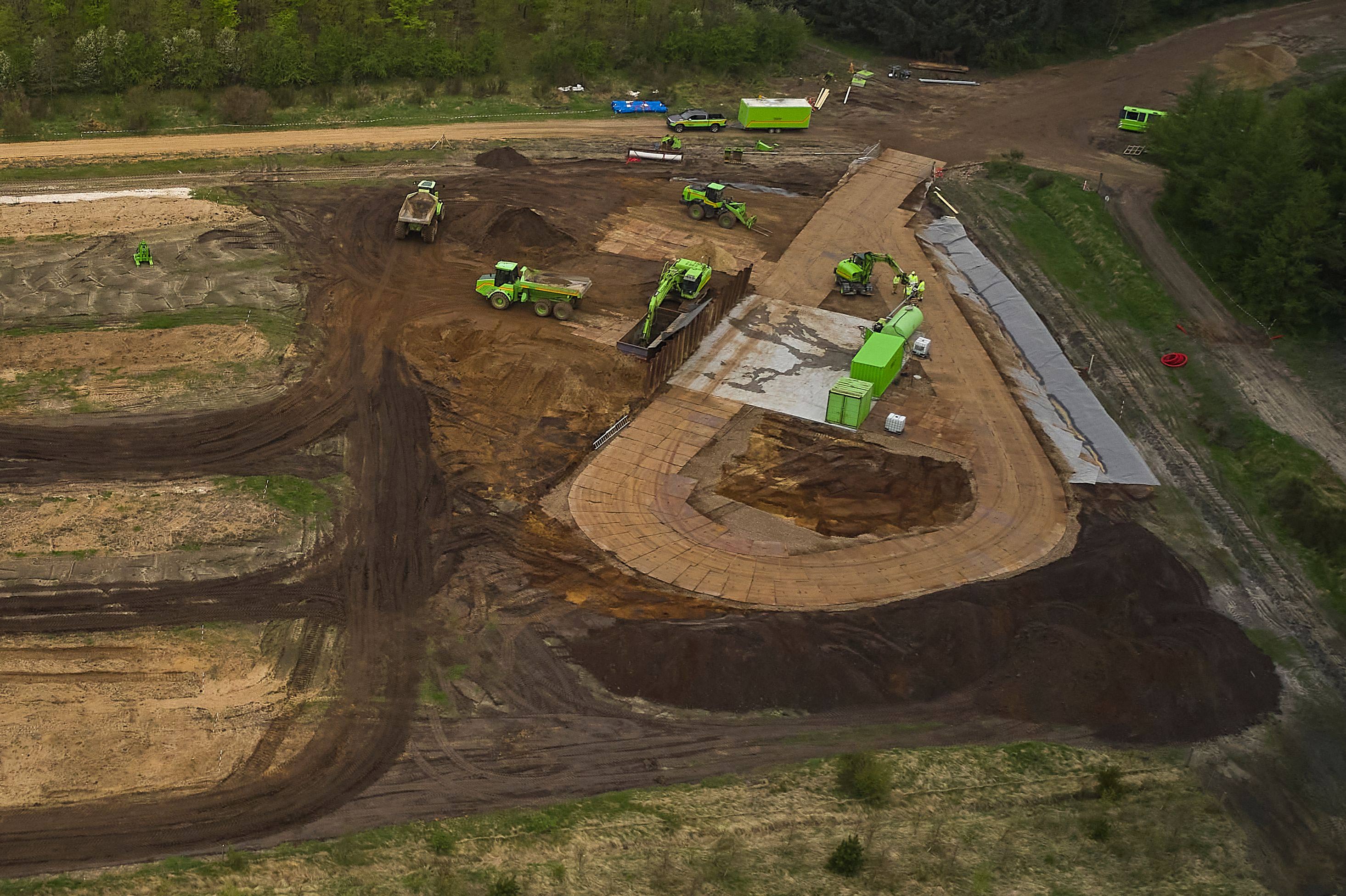 Buried mink are excavated during a trial excavation at a military area close to Norre Felding, Holstebro, in Denmark, on May 13.