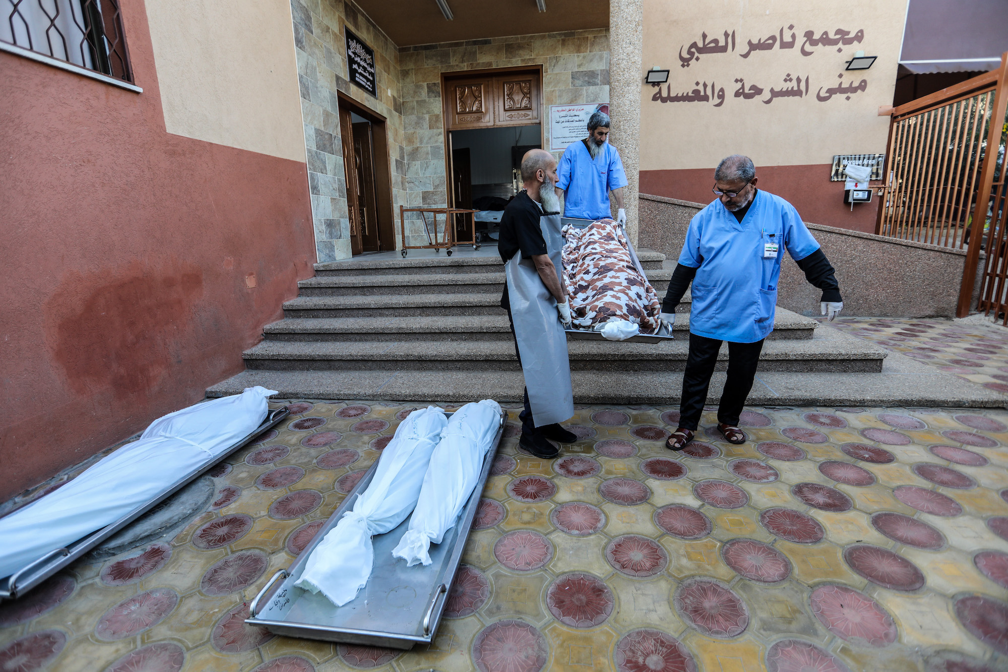 Bodies of Palestinians killed in an airstrike are seen in Khan Younis on Saturday.