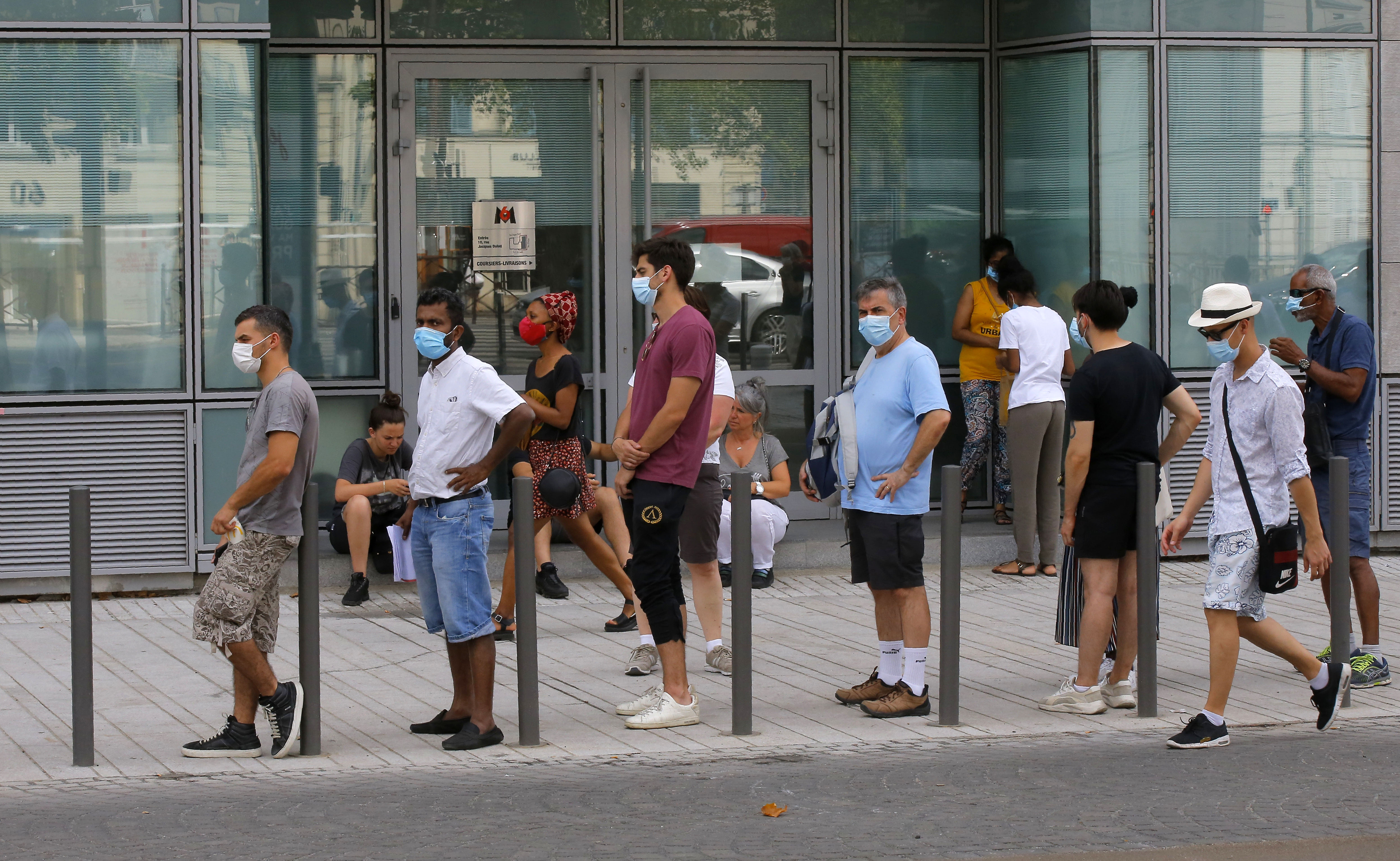 People in Paris wait in line outside a laboratory to get tested for Covid-19 on August 8.