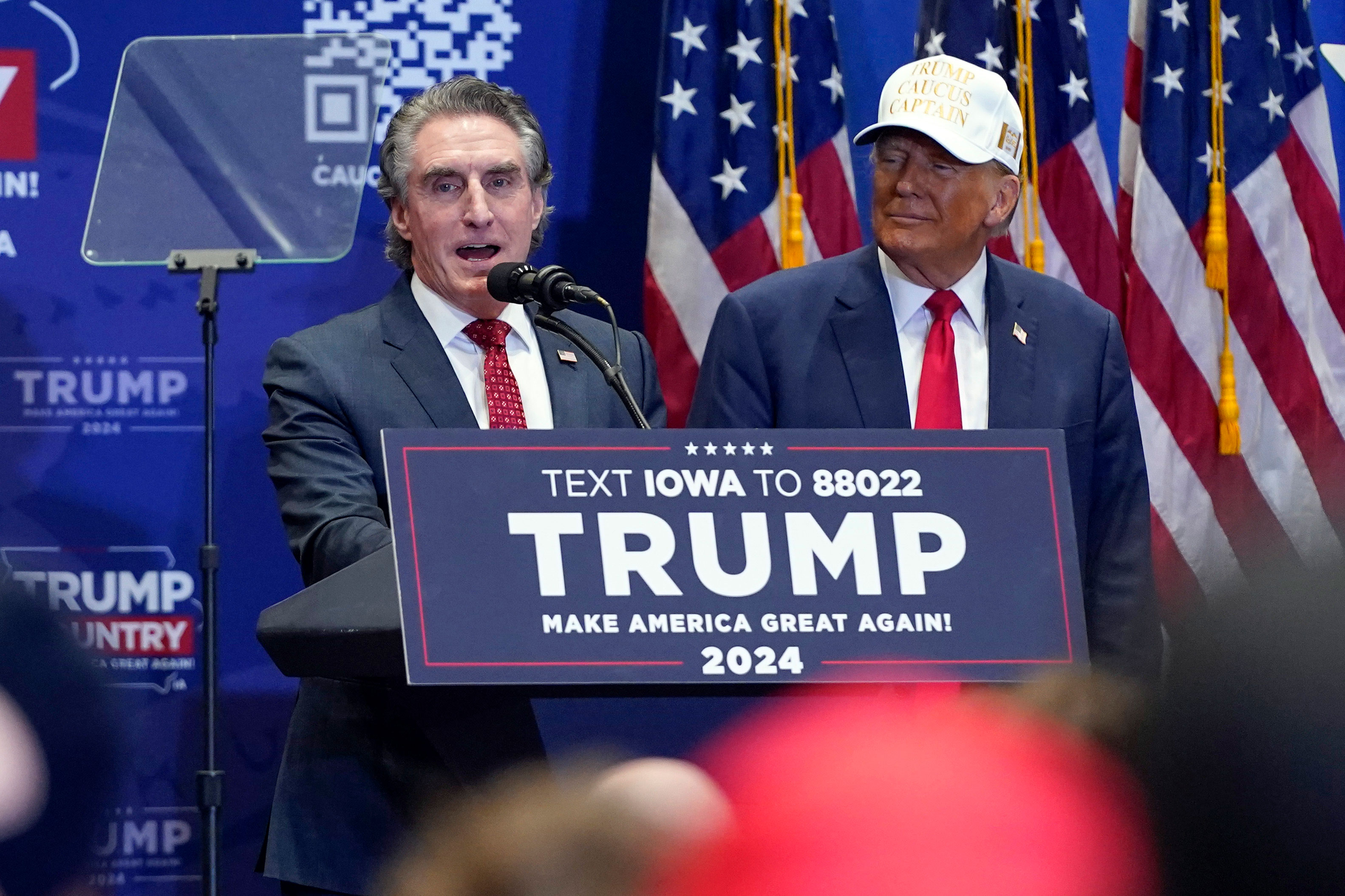 North Dakota Gov. Doug Burgum speaks at a rally with former President Donald Trump at Simpson College in Indianola, Iowa, on January 14. 