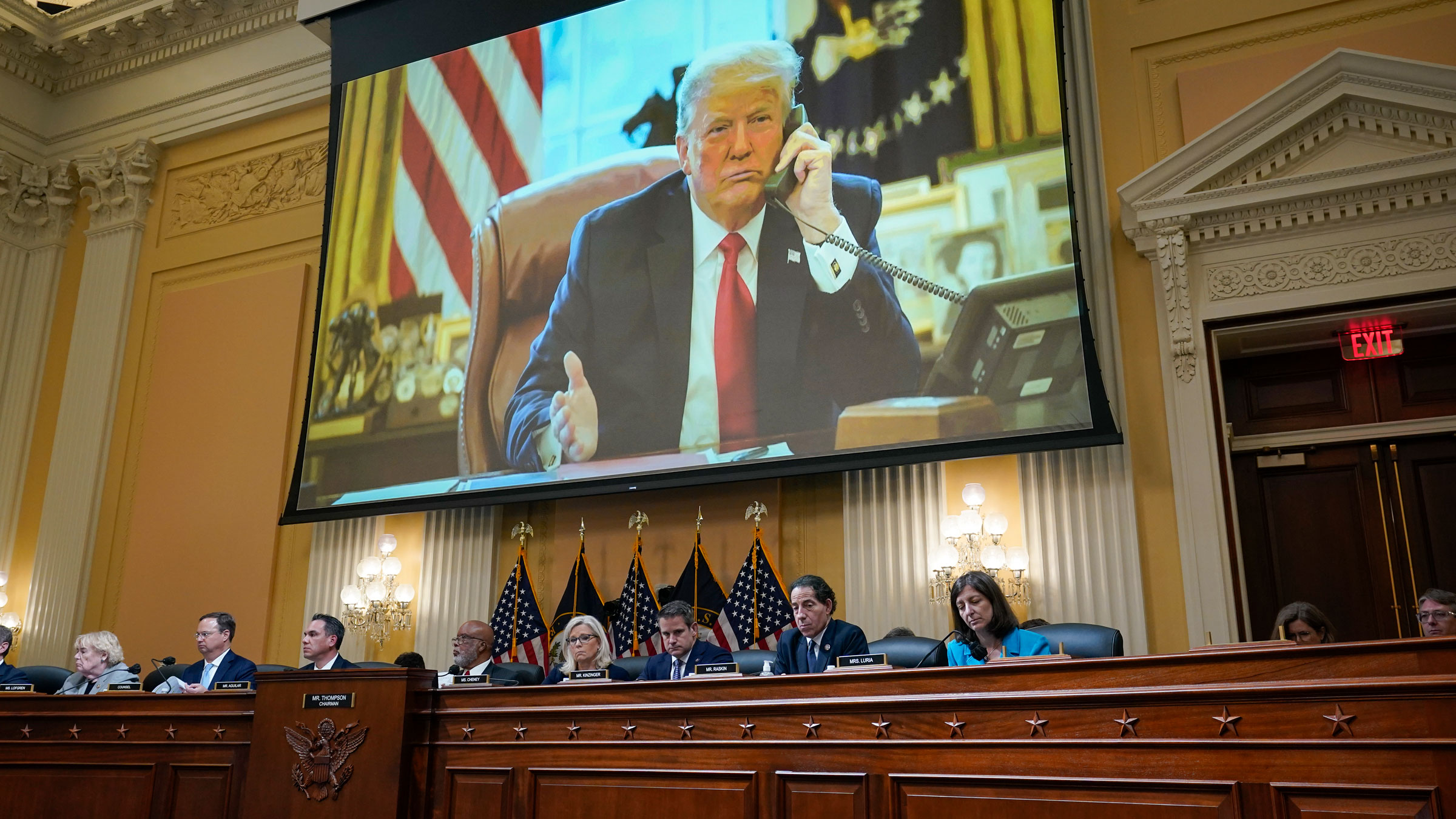 Former President Donald Trump is displayed on a screen above the committee on Thursday.