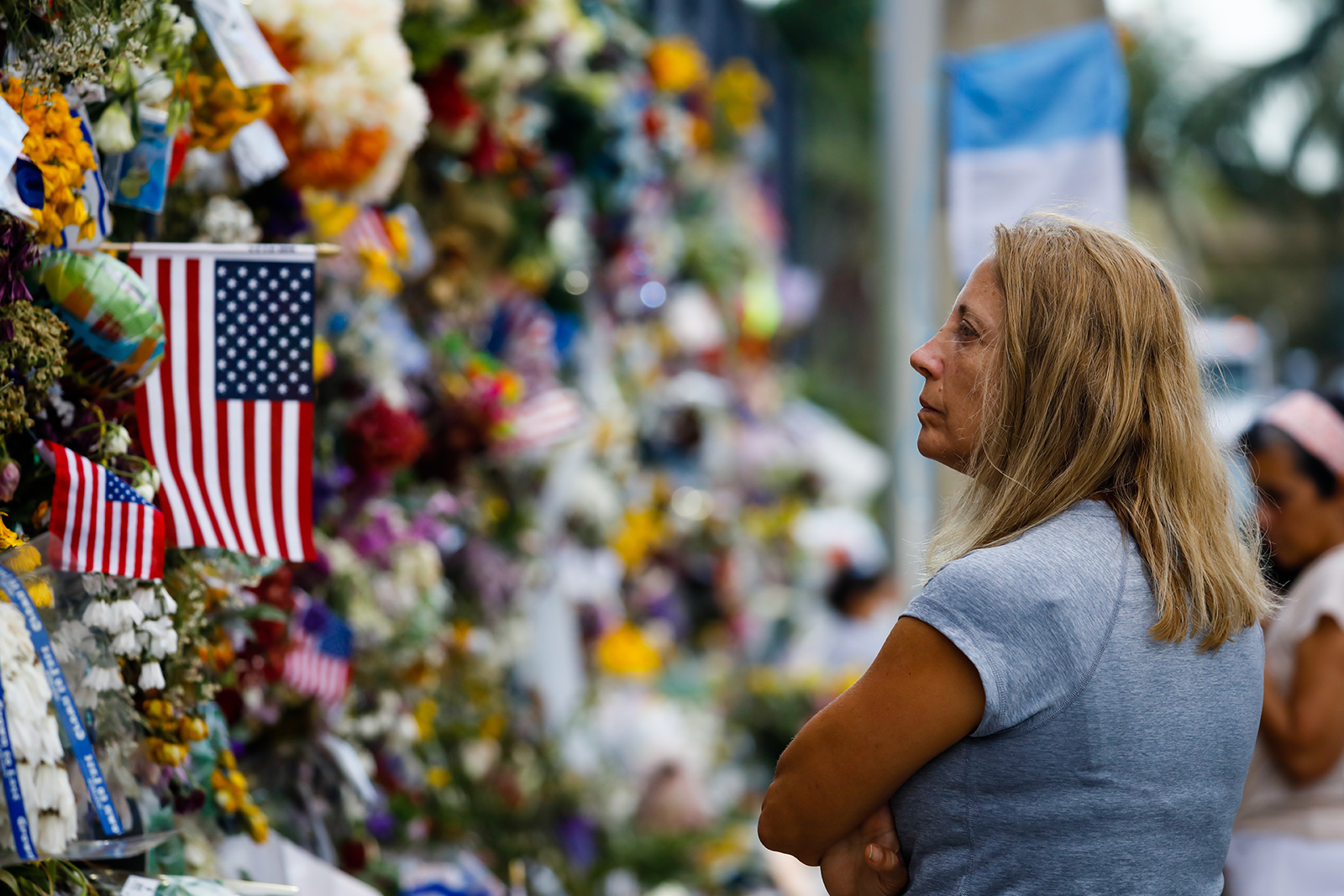 A woman is seen in front of the Surfside Wall Of Hope & Memorial on July 4, in Surfside, Florida. 