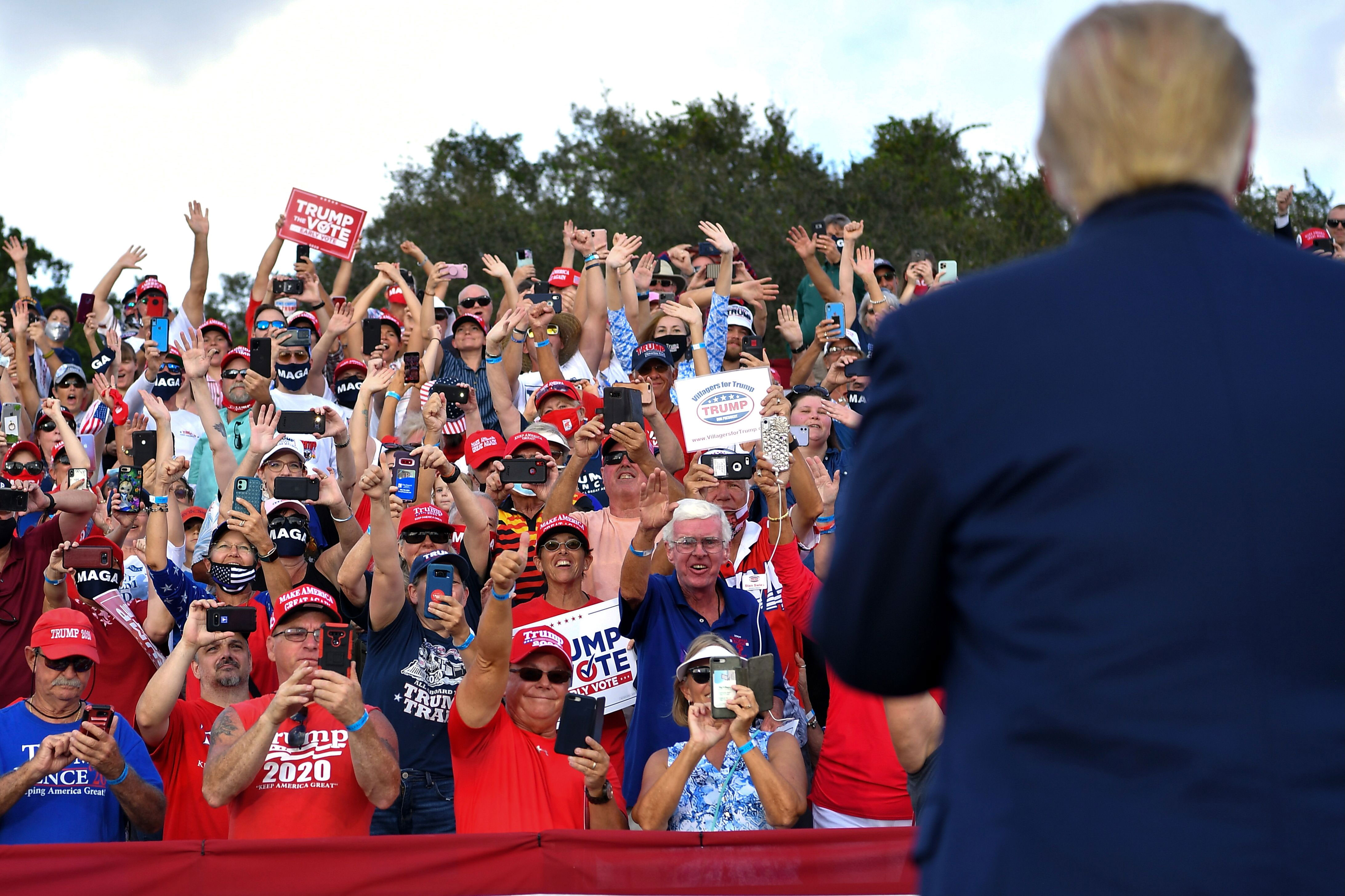 Supporters cheer as President Donald Trump arrives for a campaign rally in The Villages, Florida, on October 23.